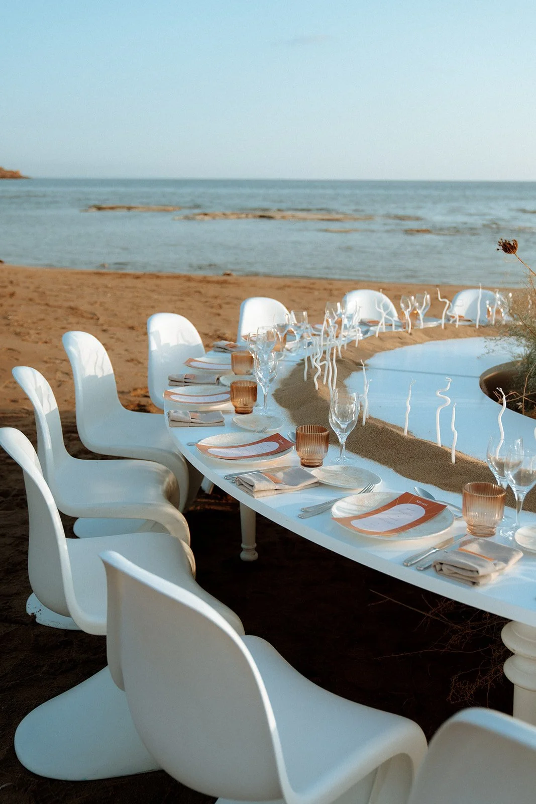 white panton chair wedding on the beach