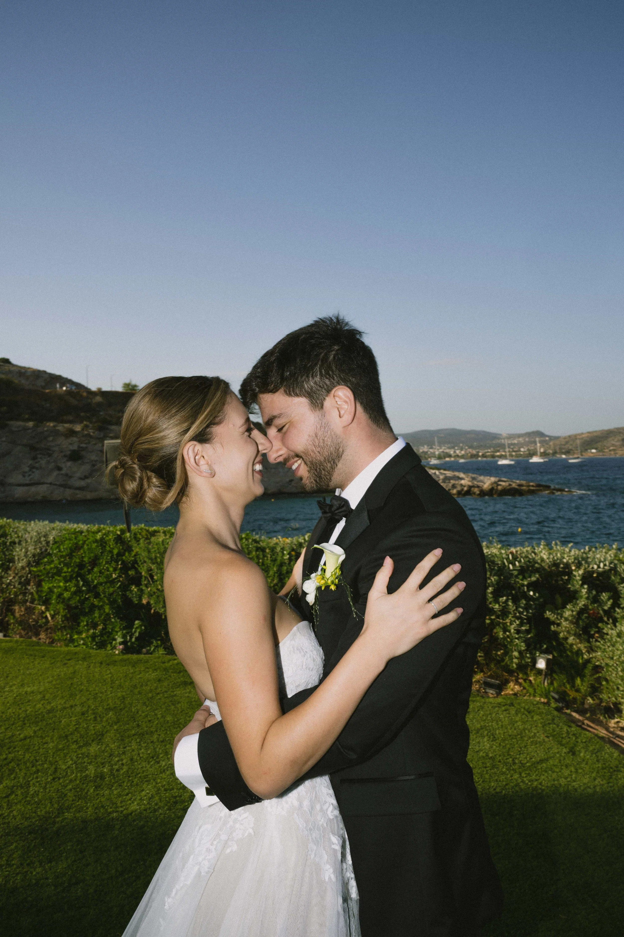 couple posing in front of the aegean sea