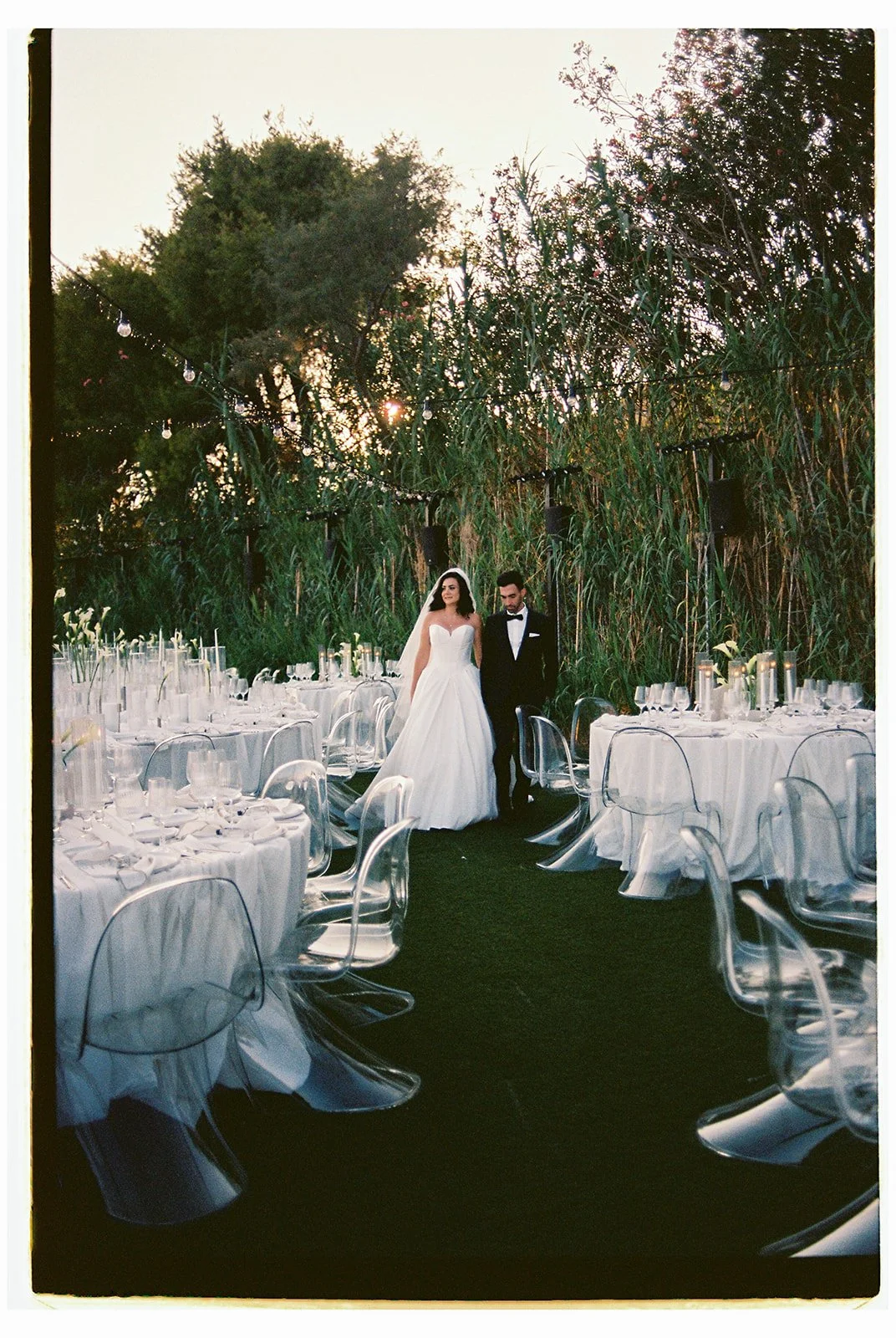 couple with white wedding setup