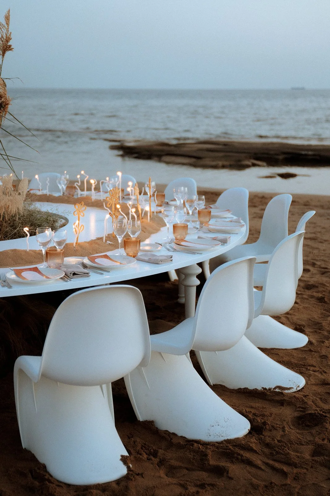 contemporary wedding setup decor with lit twisted candles