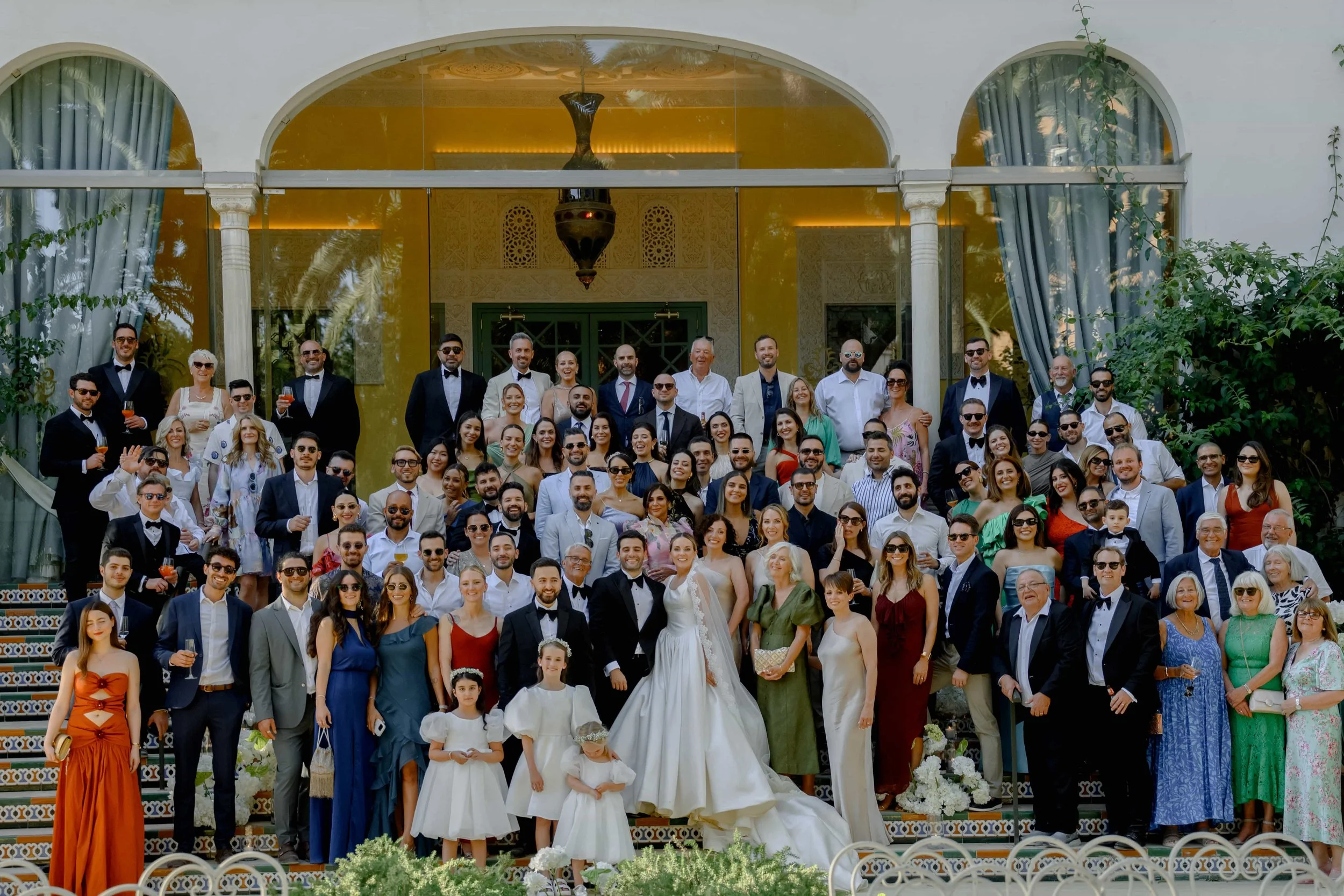 all the wedding guests with couple in one picture 
