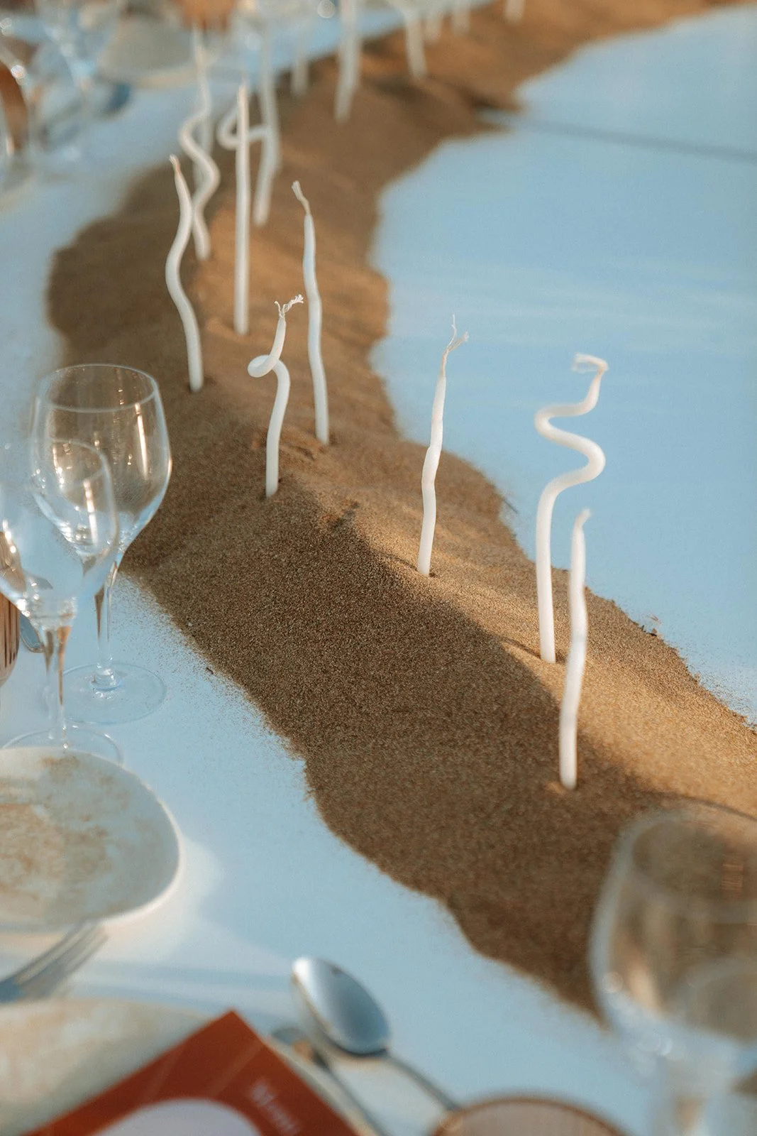 twisted white candles in sad wedding decoration