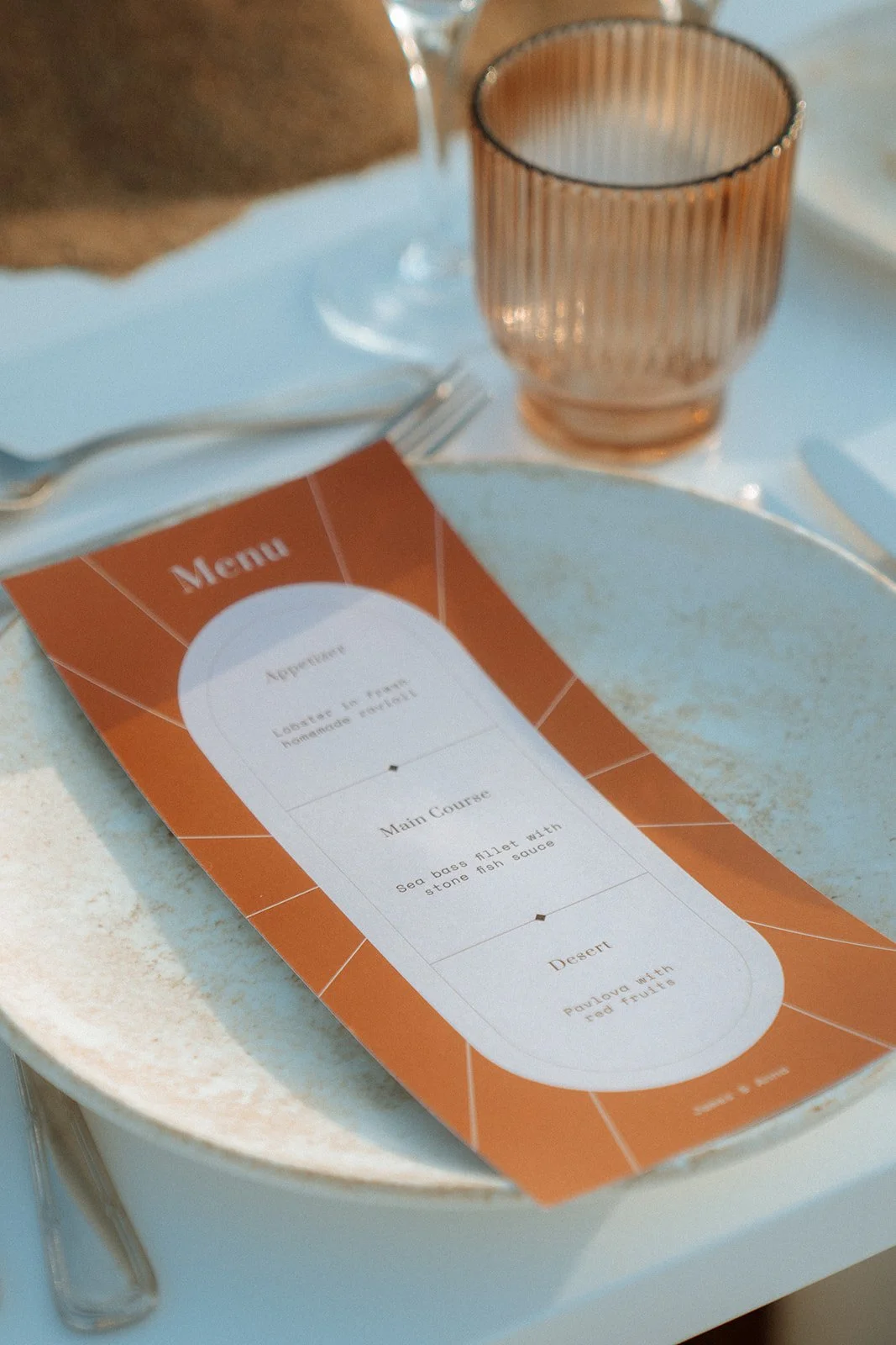 terracotta wedding menu and glassware