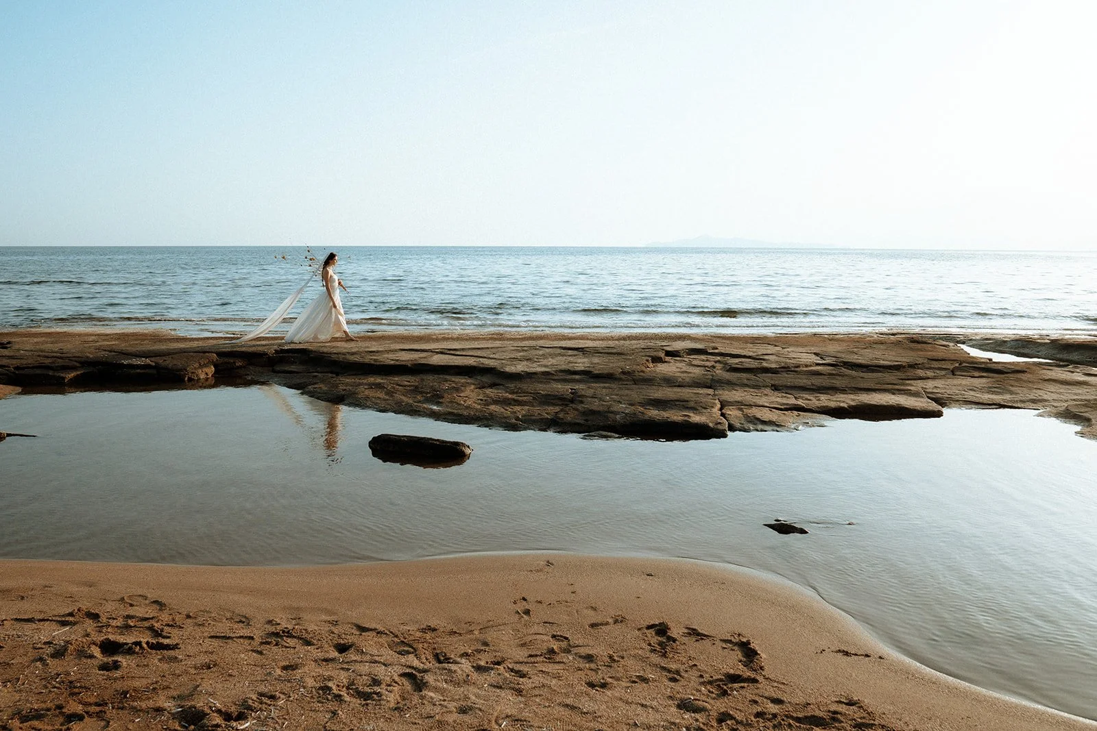 bride walking on the sea 