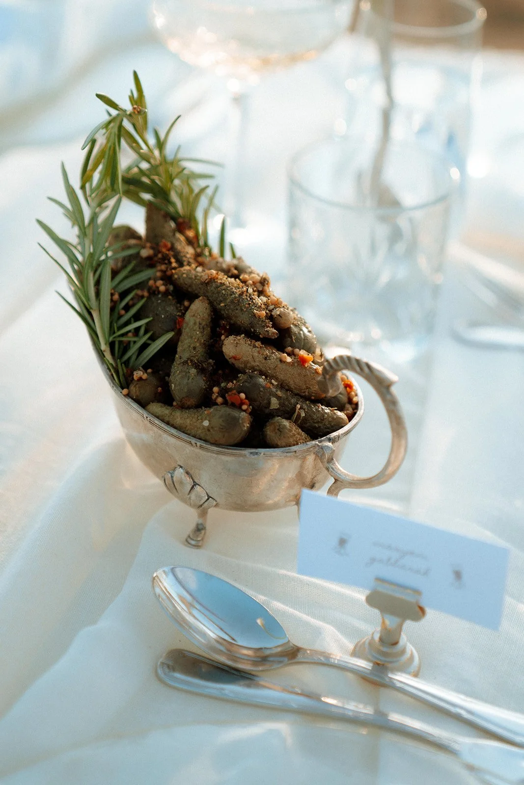 pickles and rosemary wedding decoration in silver vase 