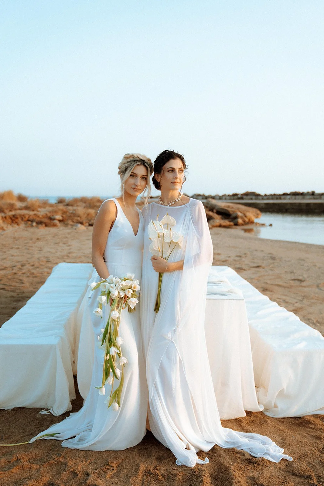 2 brides posing same sex wedding 