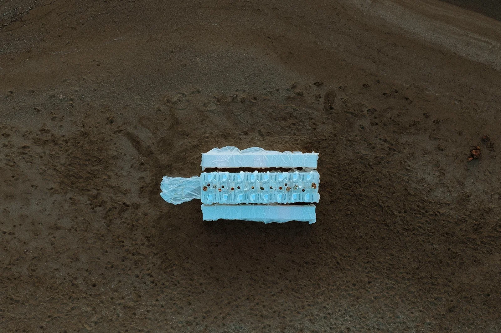 drone shot of a wedding table setup on the beach