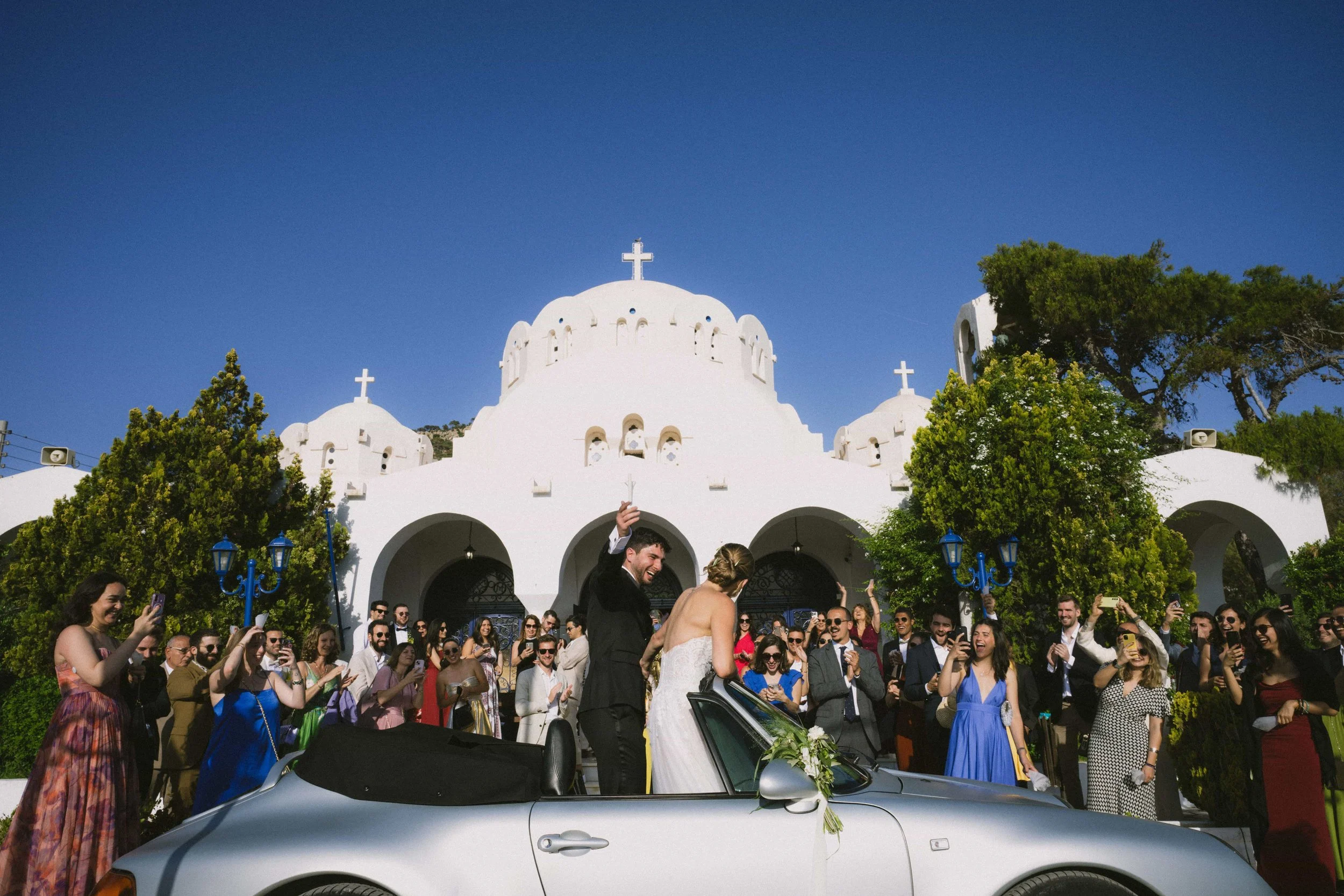 couple in a porsche 