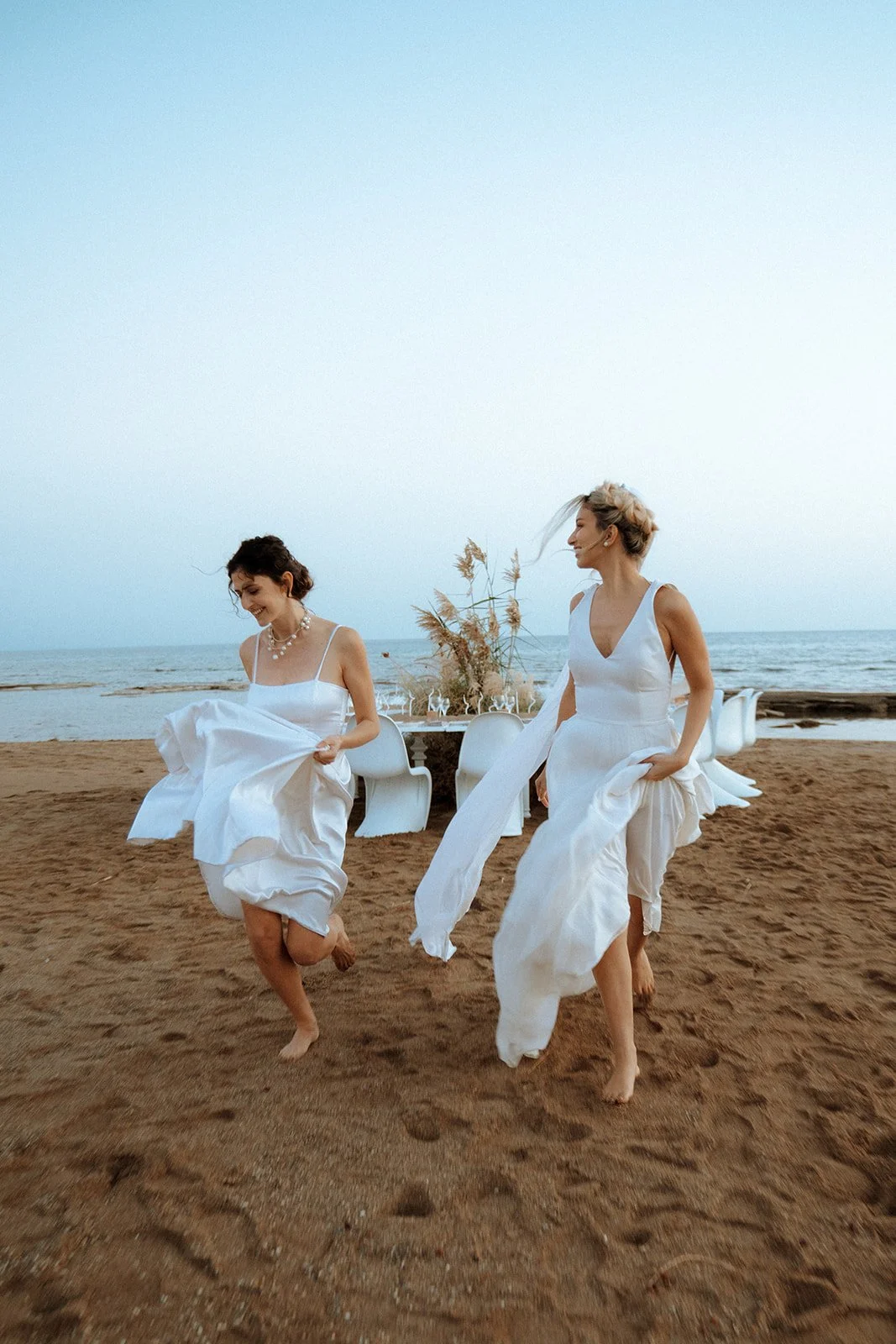 same sex couple wedding, 2 brides running