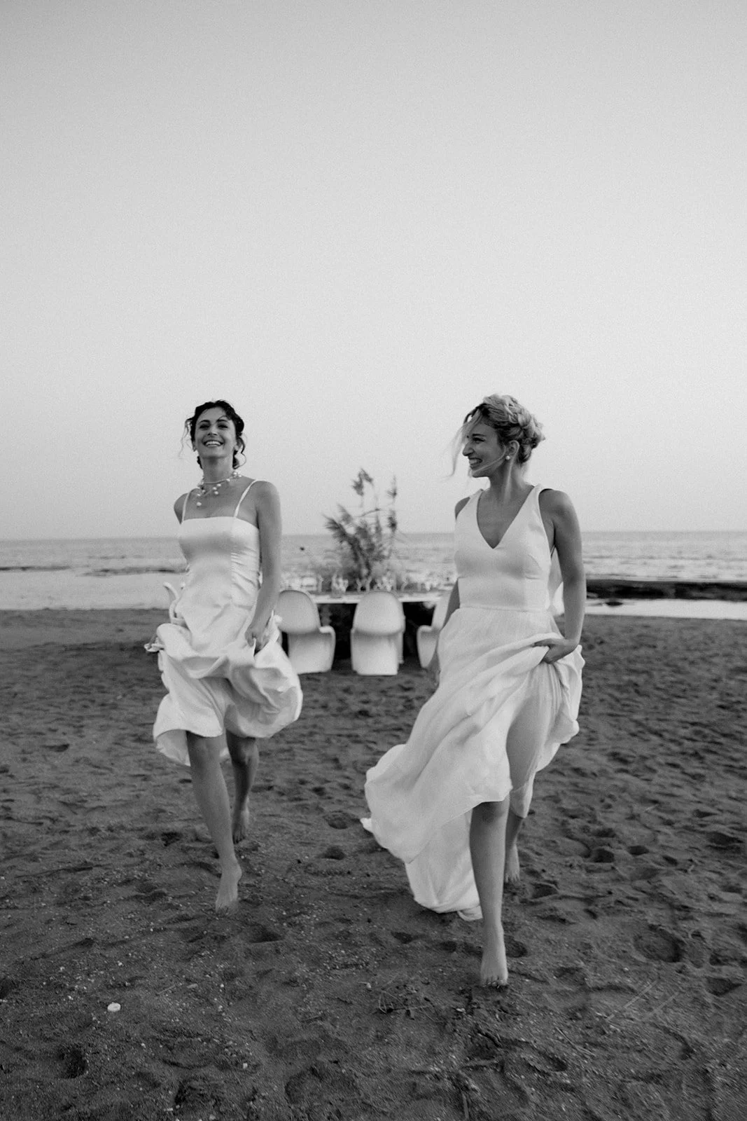2 brides running happily 