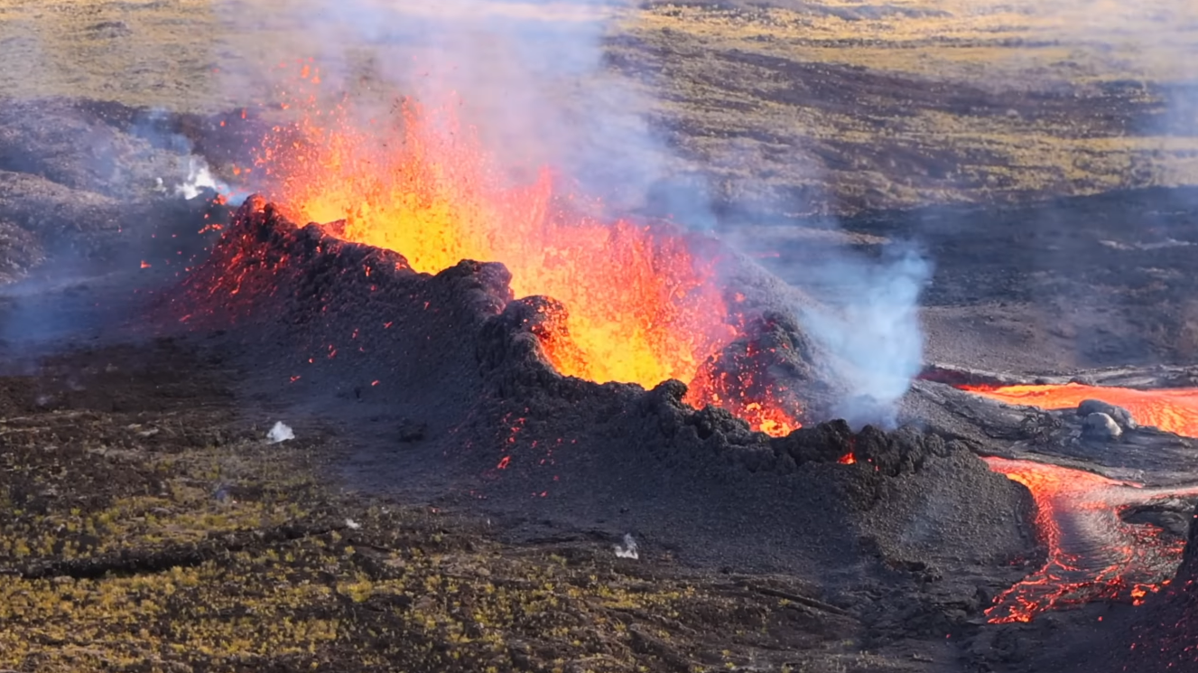 Active eruption at Piton de la Fournaise volcano with lava fountaining and fresh lava flows, Réunion Island