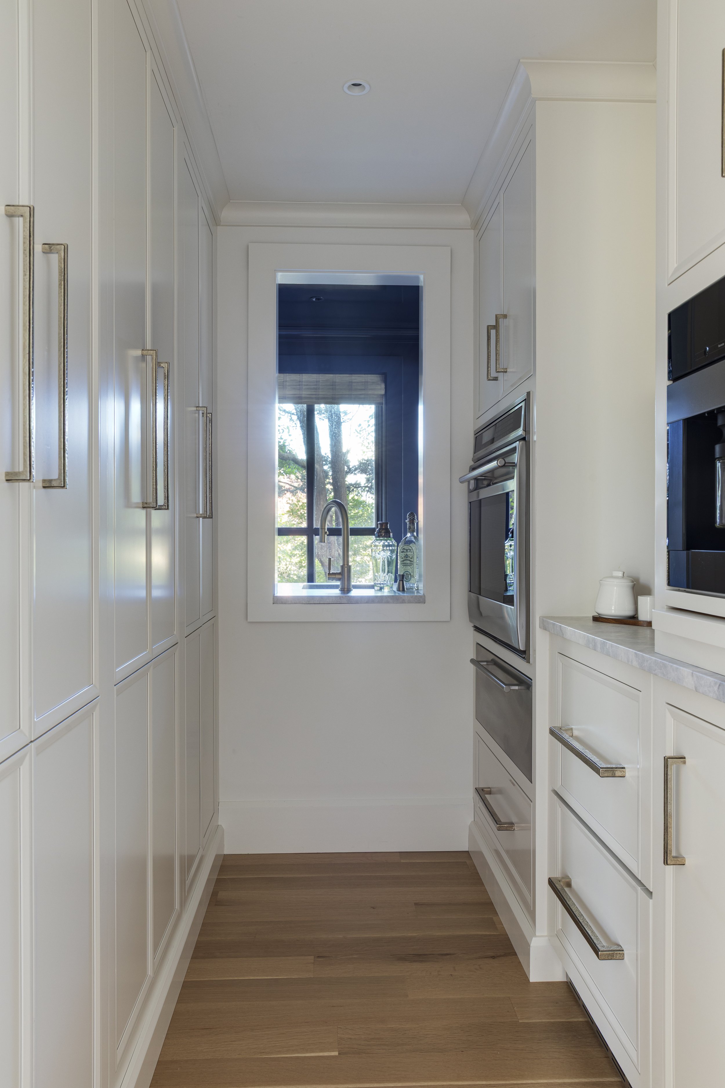 custom pantry cabinetry, white cabinets, brushed brass hardware