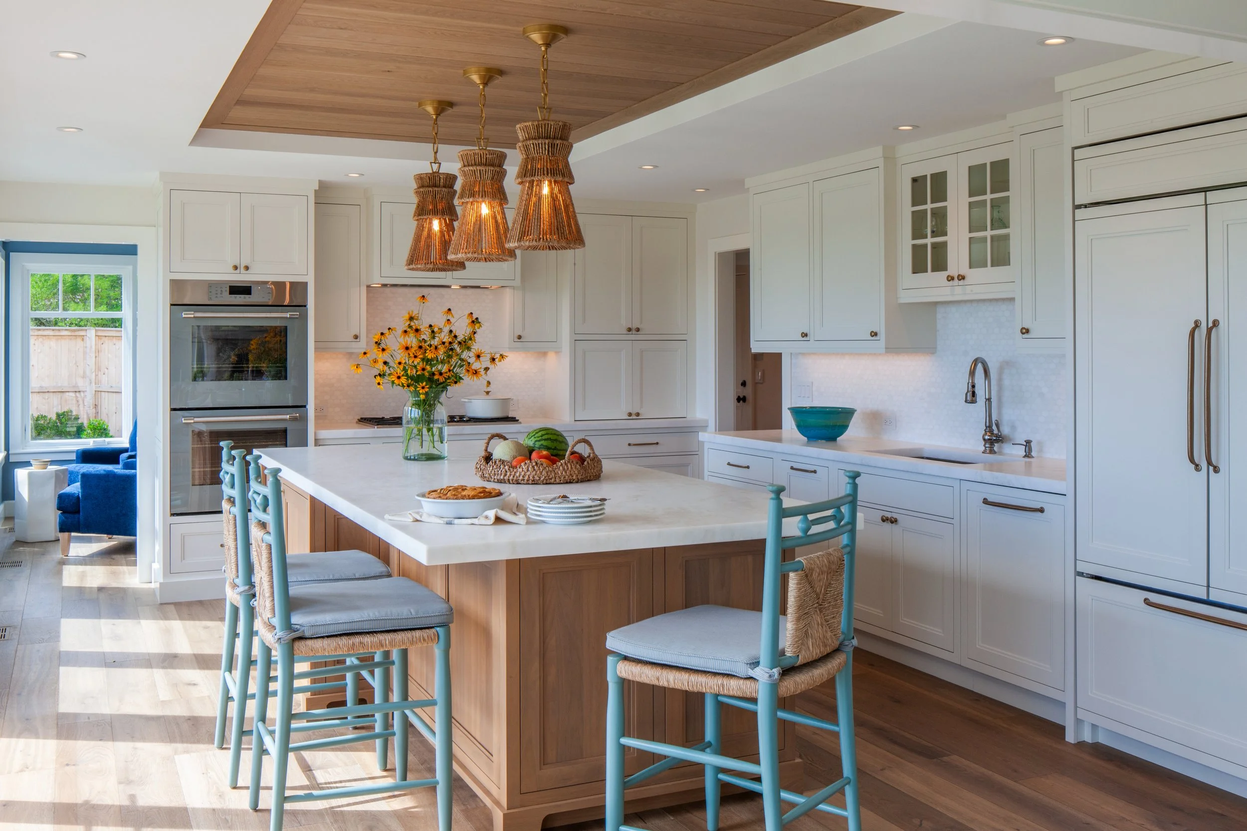 waterfront coastal kitchen cabinetry with brass hardware, white cabinets