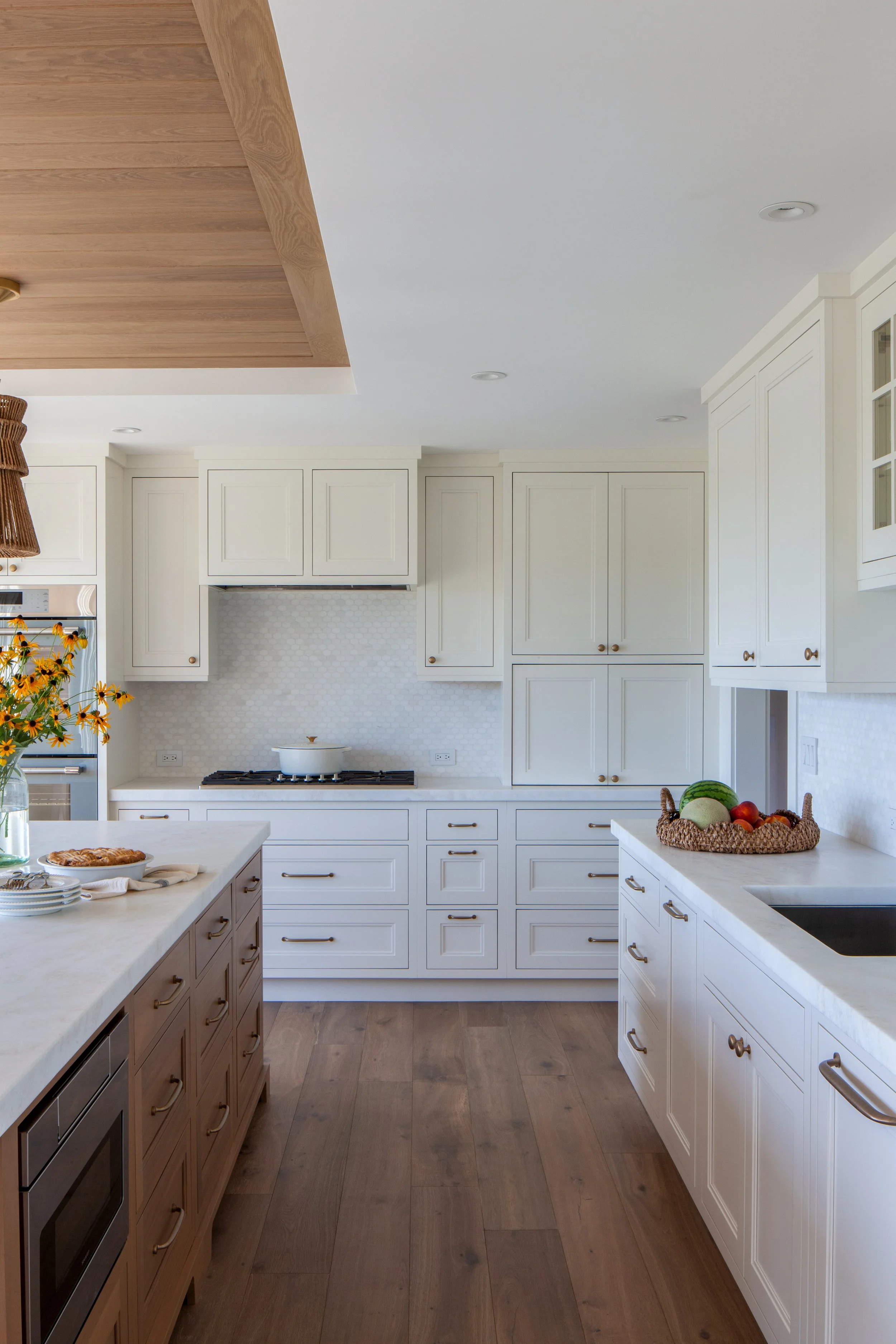 waterfront coastal kitchen cabinetry with brass hardware, white cabinets