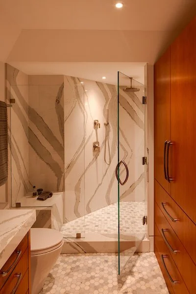 custom vanity and custom linen closet cabinetry, warm stain finish