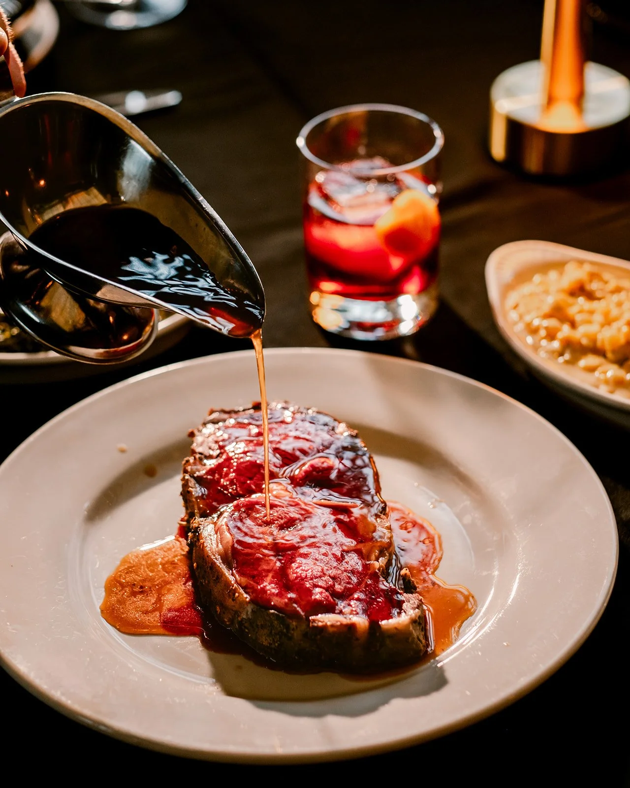 prime rib with aujus in elegant setting