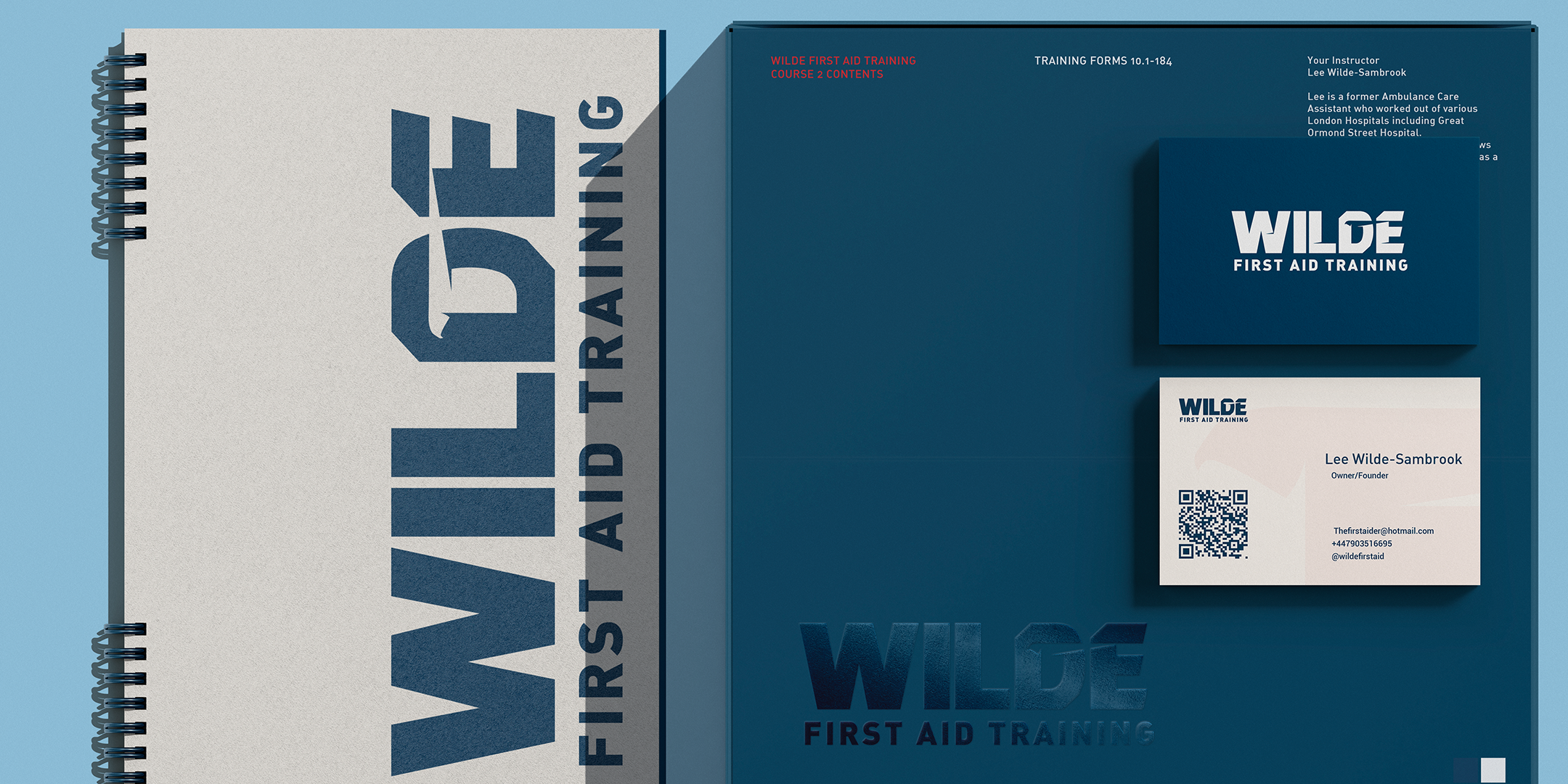 WILDE First Aid Training branding with a spiral-bound notebook, blue folder, and business card. The text includes "WILDE FIRST AID TRAINING" and course information. Instructor is named as Lee Wilde-Sambrook.