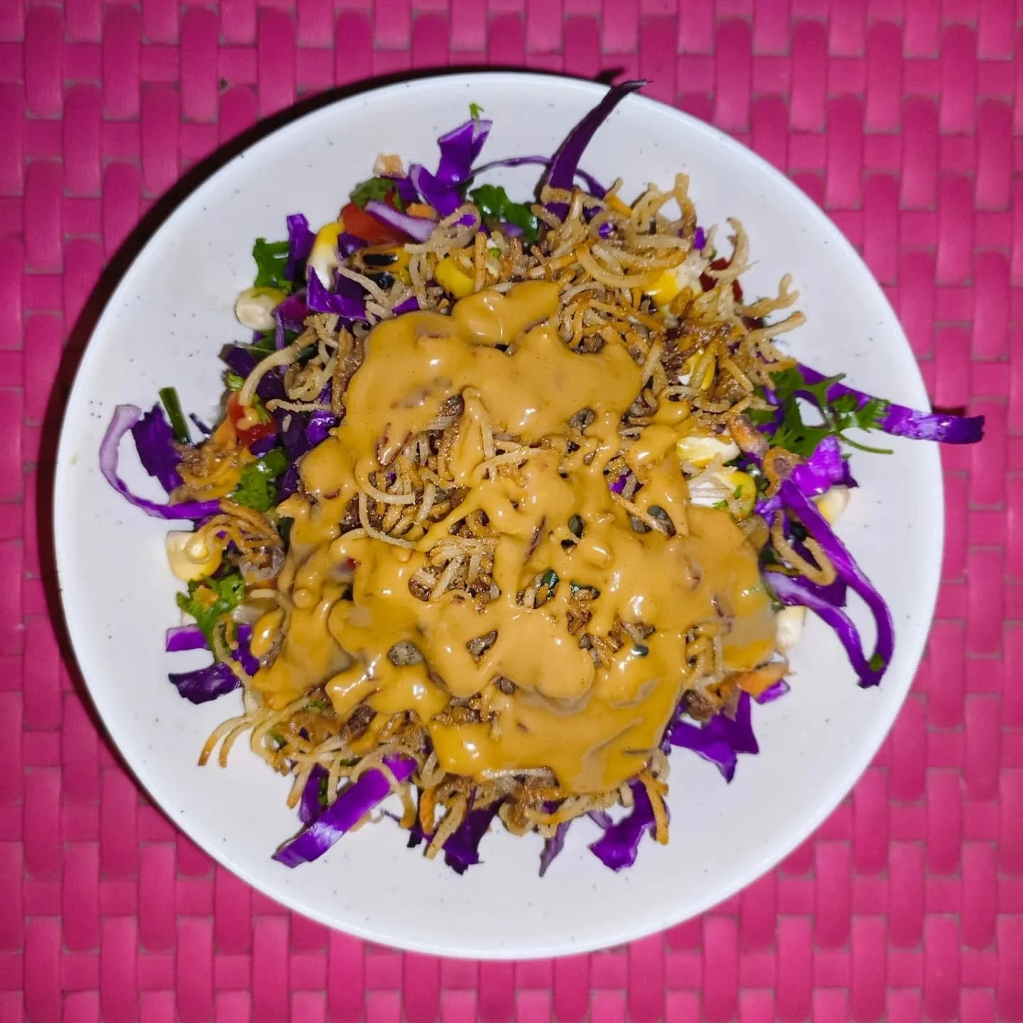 New favourite salad I made today - 
- topping / shallow fried a bunch of broken noodles in a pan
- main salad mix / roasted corn + purple cabbage + grated carrot + chopped bell peppers + cucumber + spring onion and dhania for herbs 
- dressing / pean