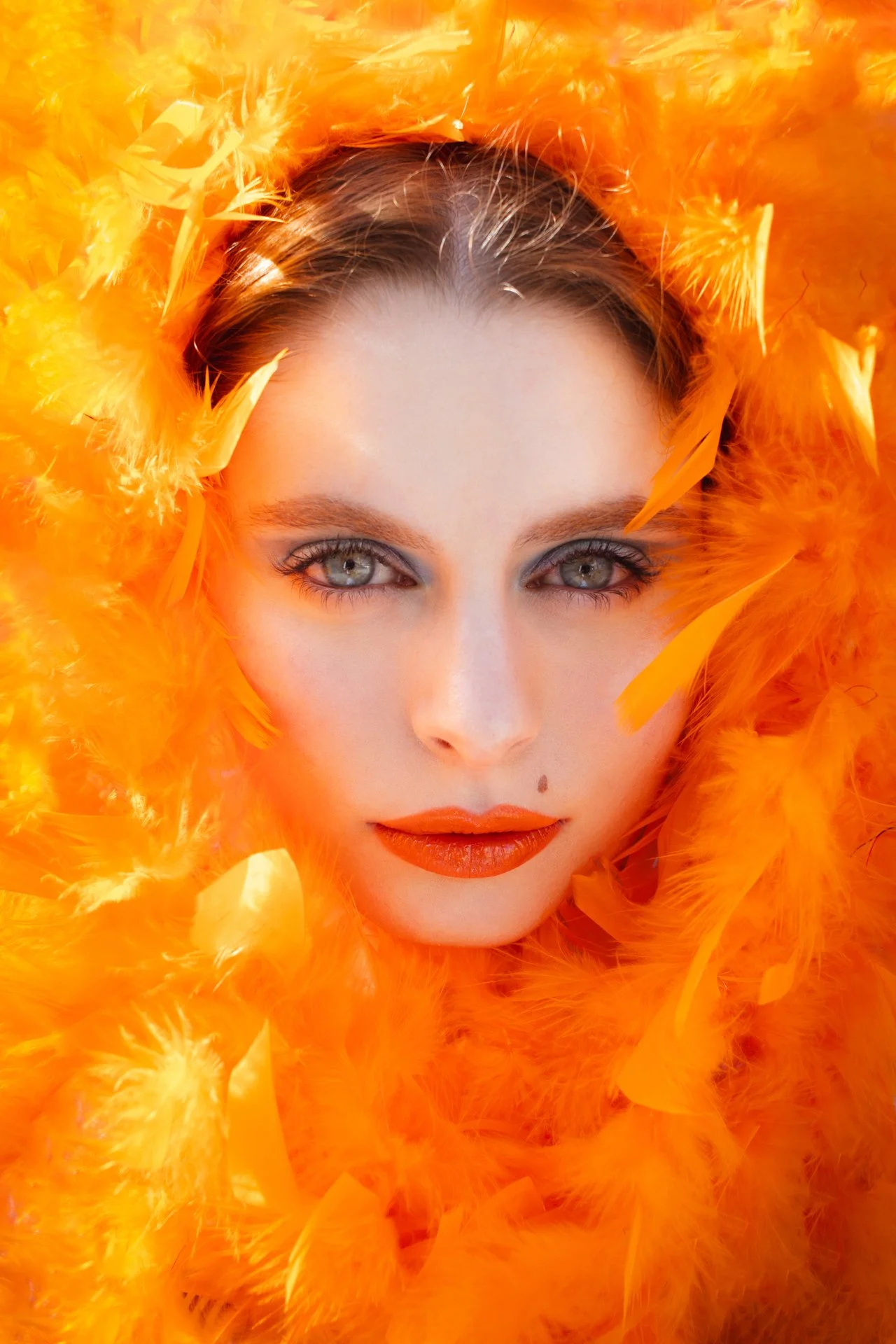 Portrait of a girl with orange fur boa