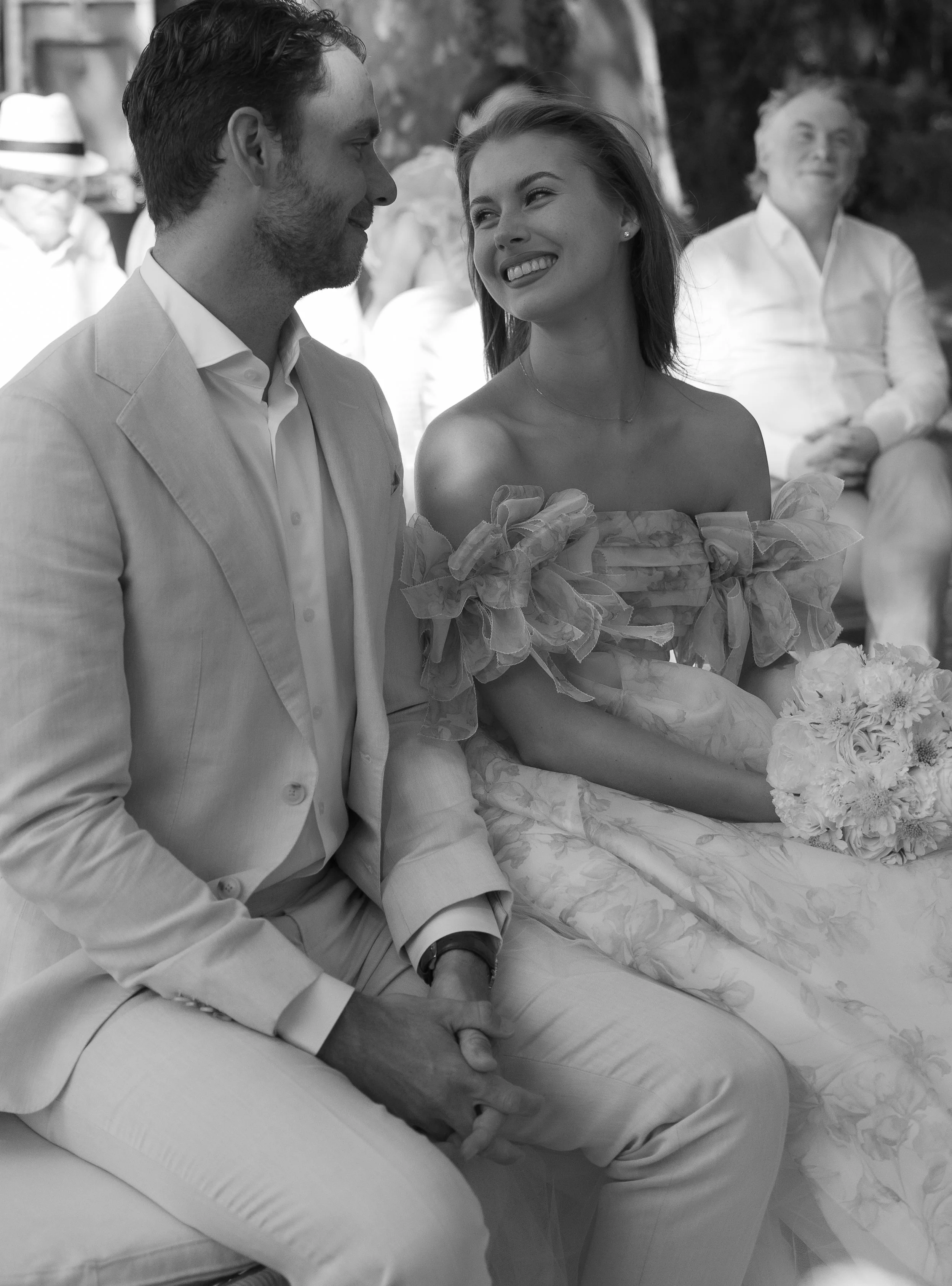 Bride and groom smiling during outdoor wedding ceremony in Provence, France
