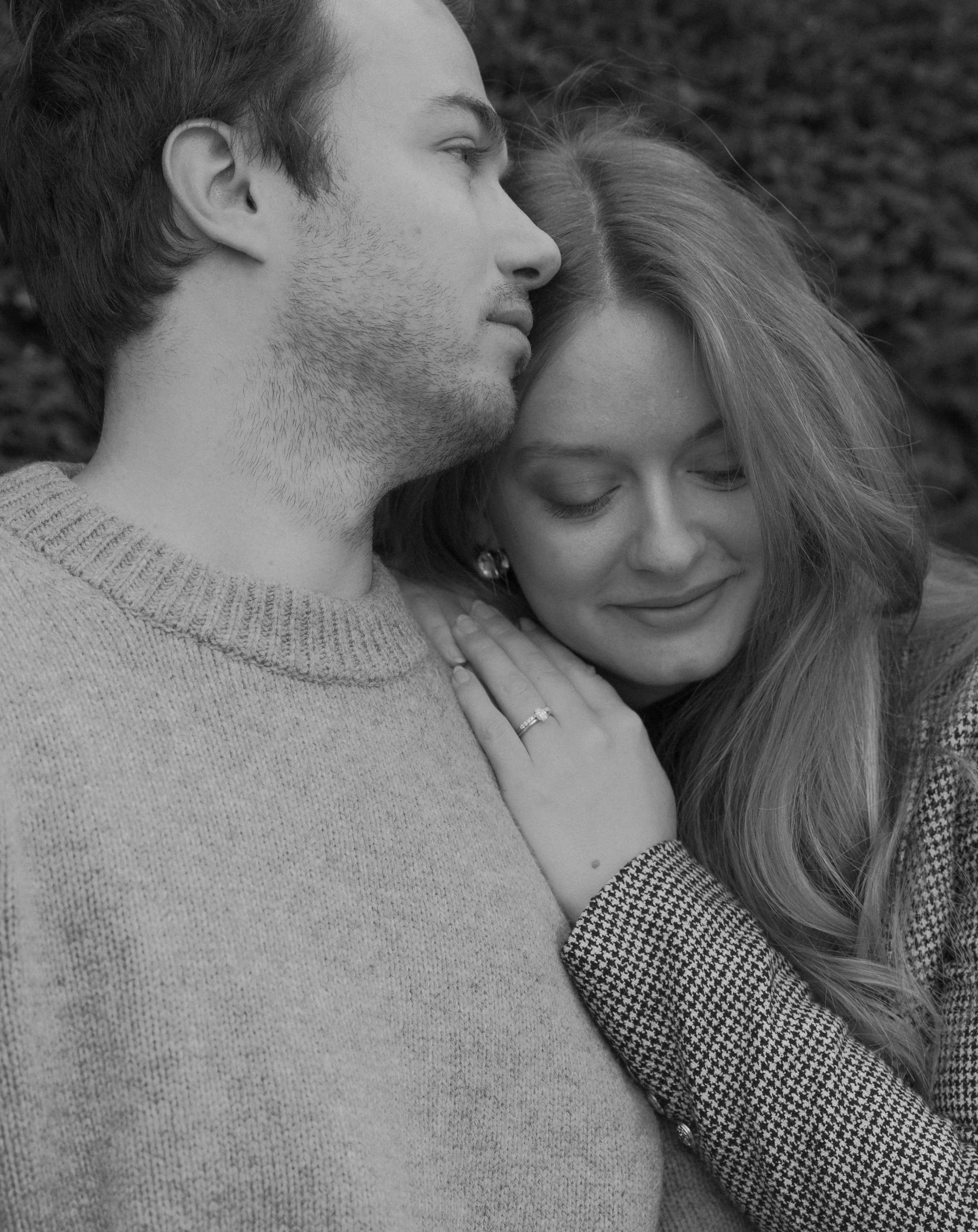 Intimate engagement portrait in Paris featuring couple embracing in soft natural light