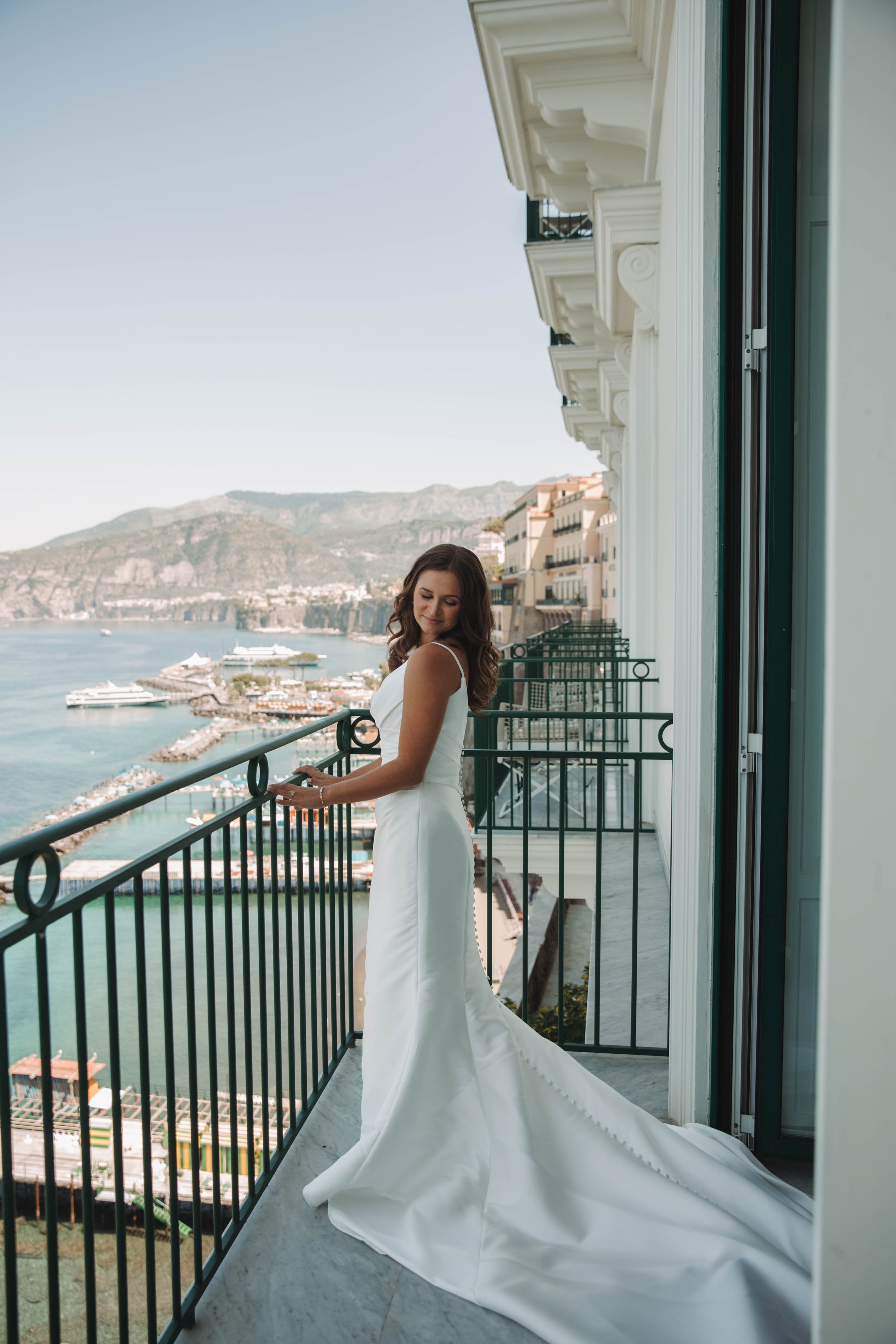 Bride on her balcony at the Bellevue Syrene overlooking the Marina Piccola in Sorrento