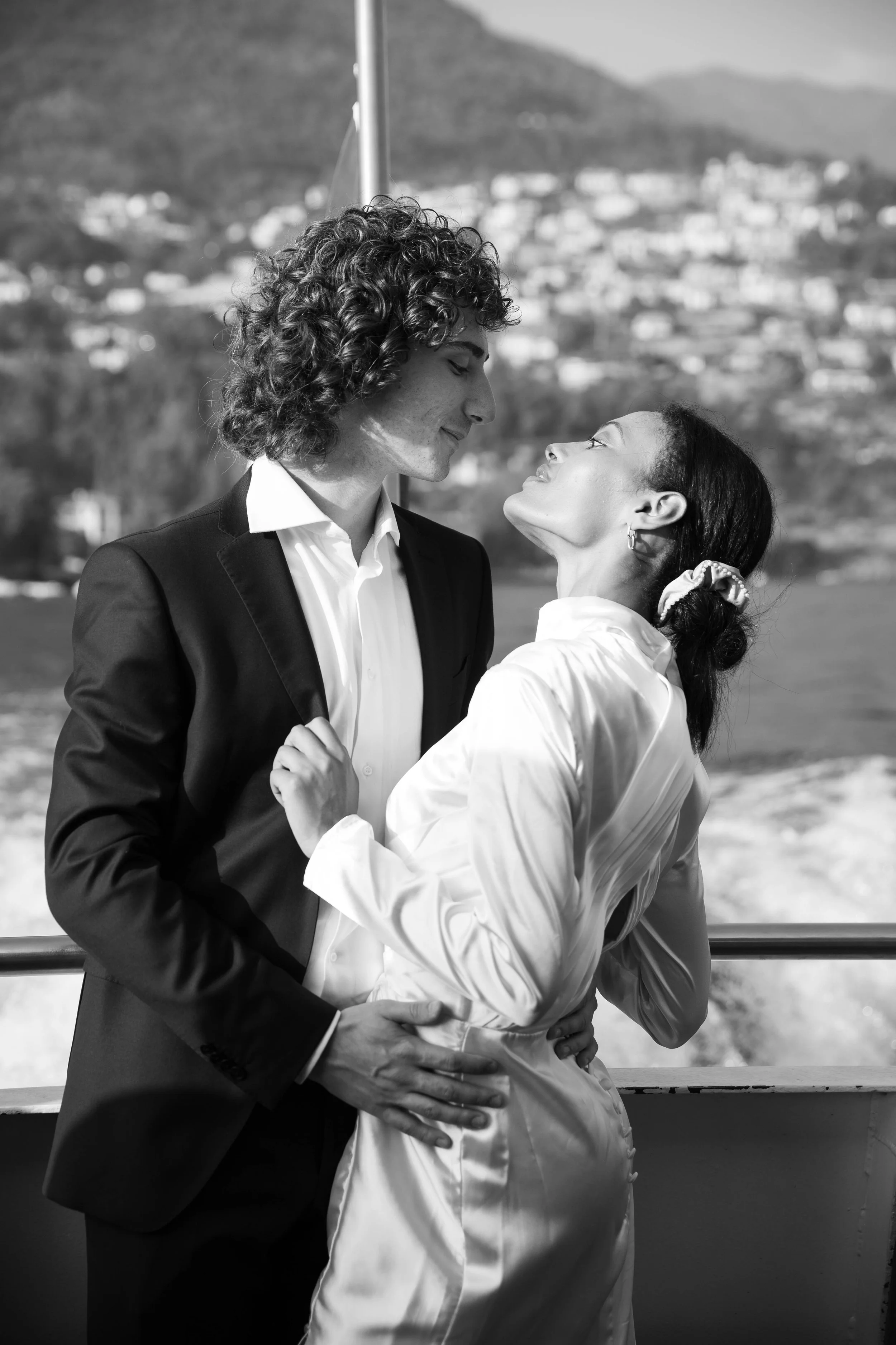 Black and white portrait of a couple on a Lake Como ferry during a styled elopement