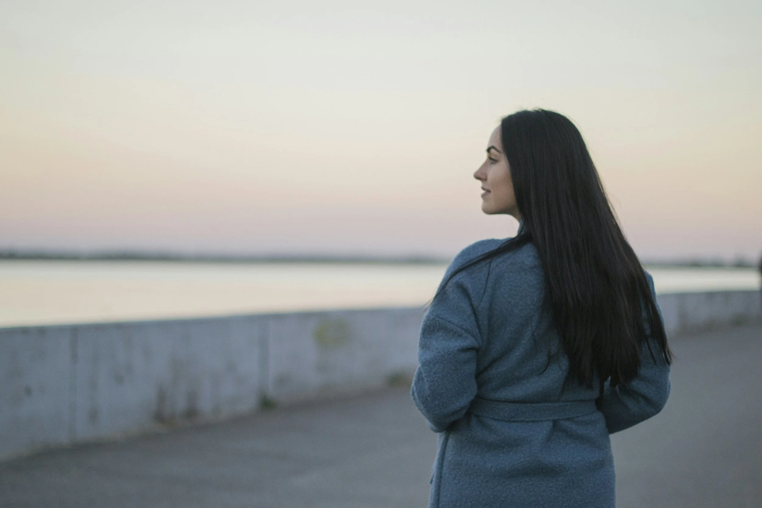 peaceful woman walking near water after therapy for autism in baton rouge