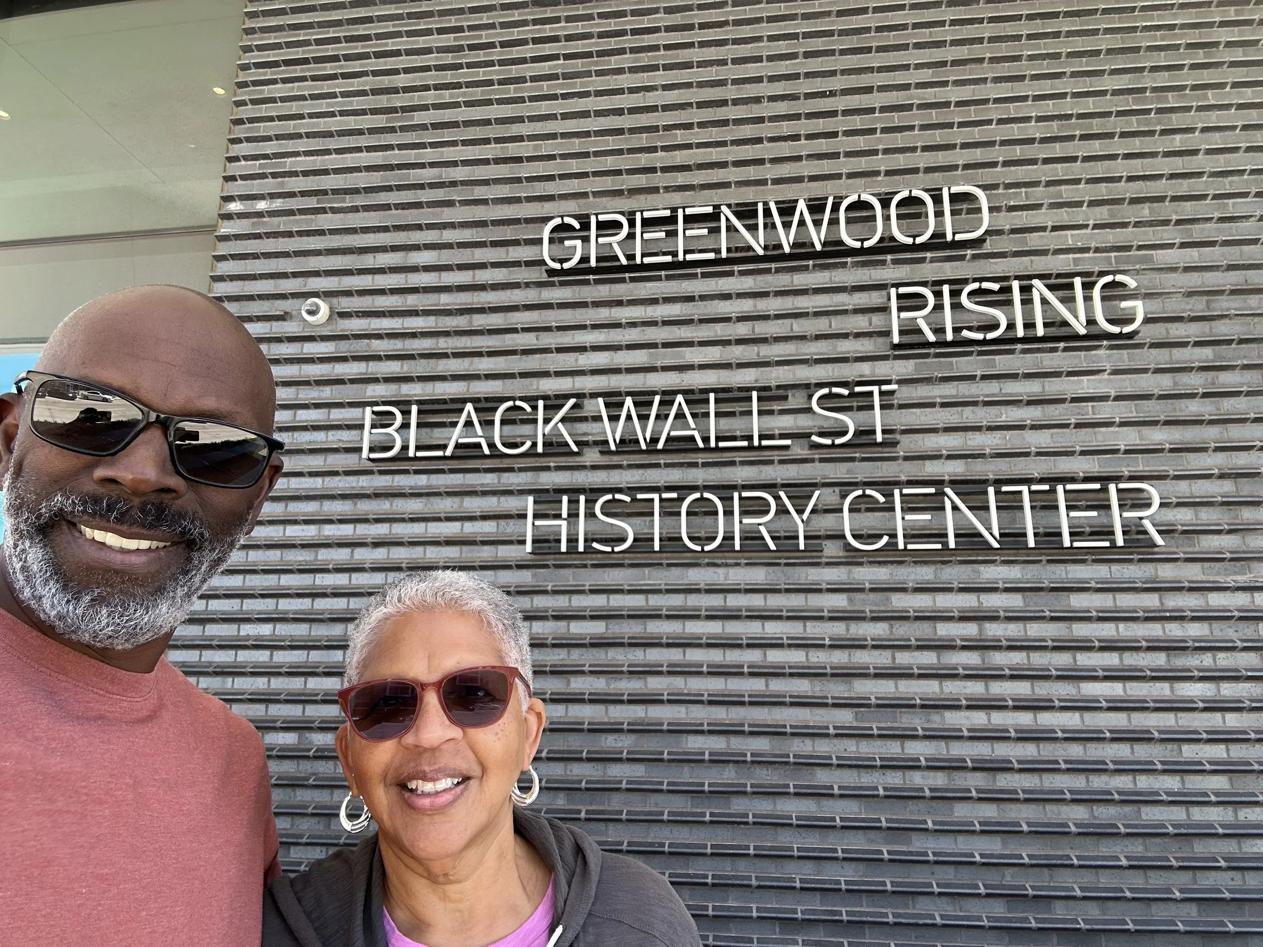 Duane &amp; Belinda of All About the Banks in front of Black Wall Street