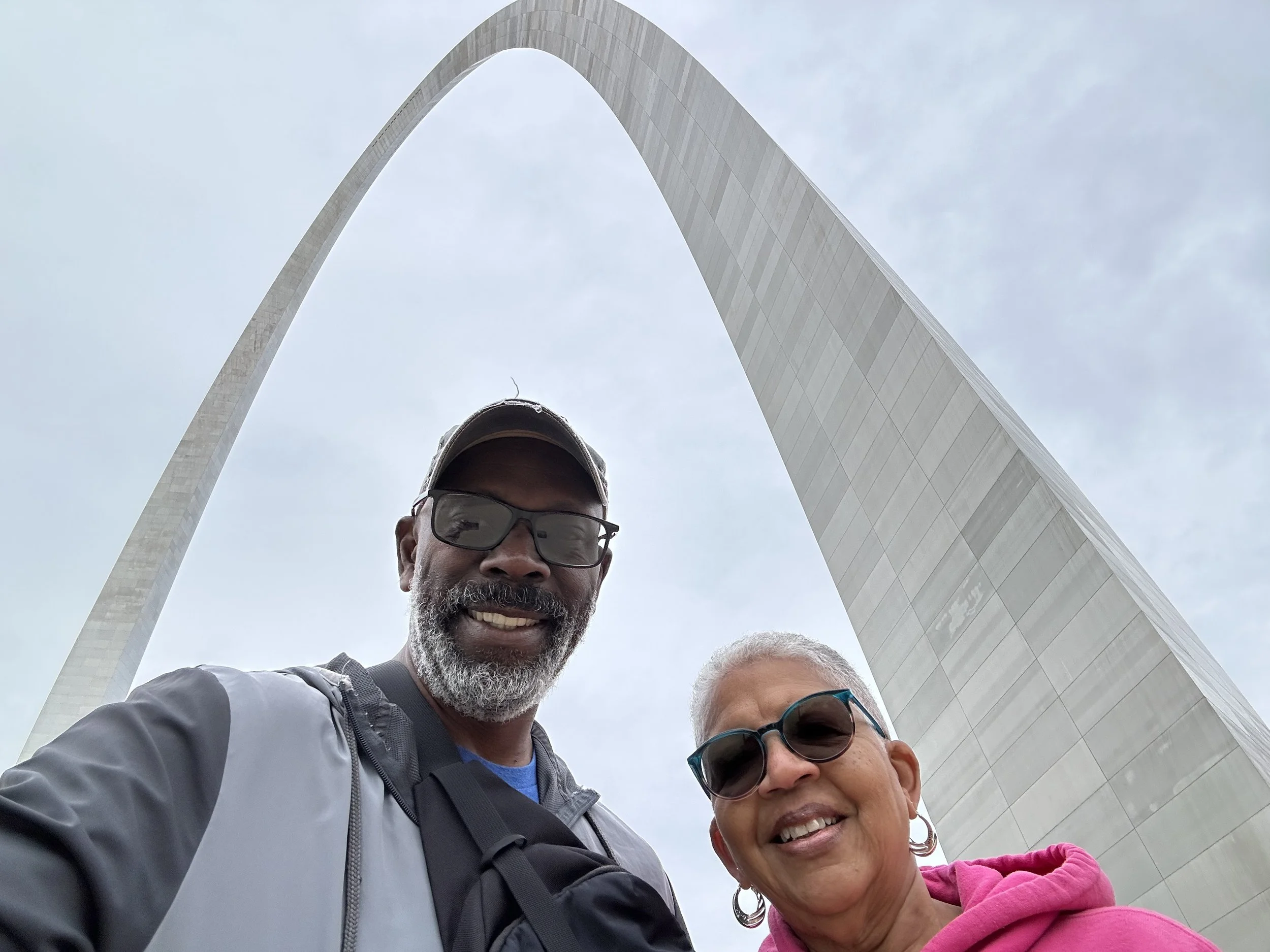 Duane &amp; Belinda of All About the Banks in front of the Gateway Arch in St. Louis, MO