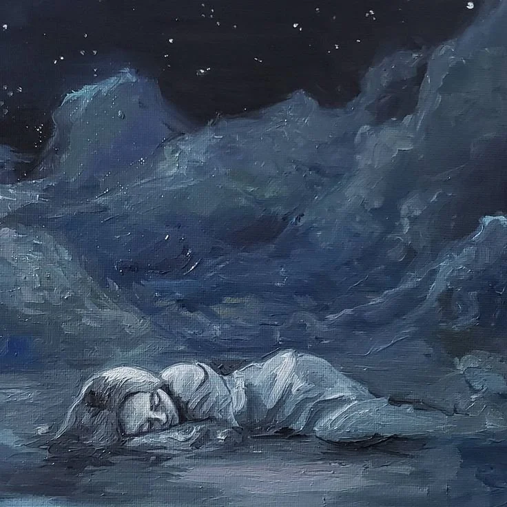 A child sleeping on a pathway at night, curled up with their head resting on their arms, surrounded by dark, cloudy sky.