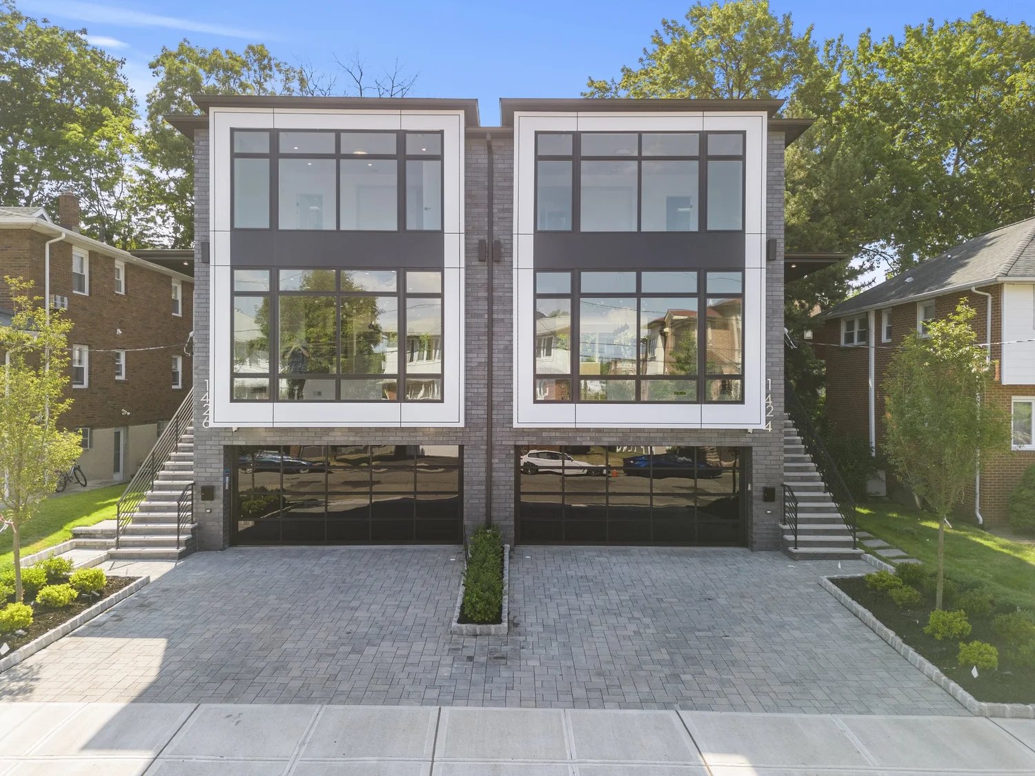 1424 14th St: two attached modern homes with dark window frames and glass garage doors