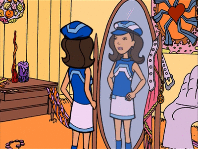 A girl looking at herself in a mirror, trying on a blue and white uniform with a hat, in a colorful room decorated with pictures, jewelry, and a bed.