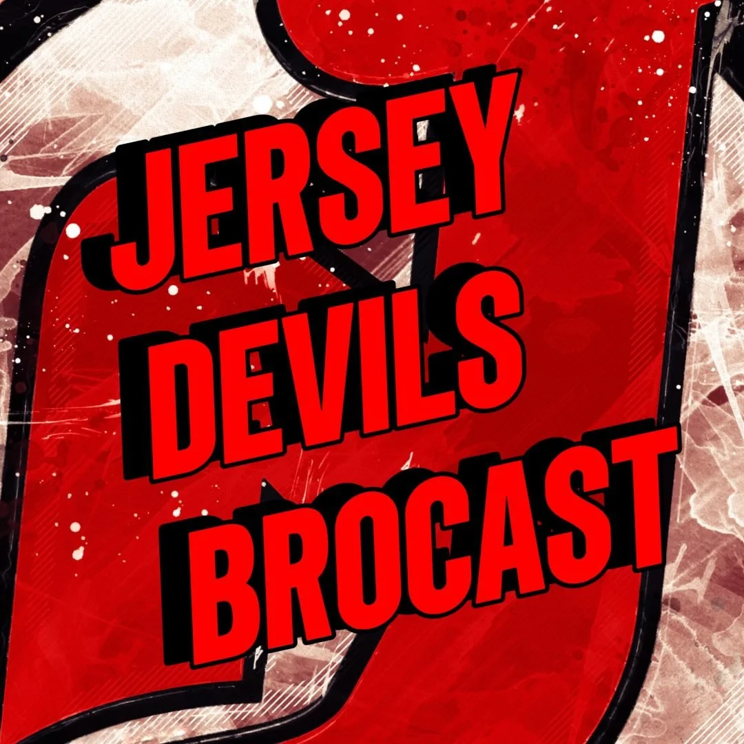 Red sports jersey with black and white accents and the words "Jersey Devils Brocast" in bold red and black lettering.