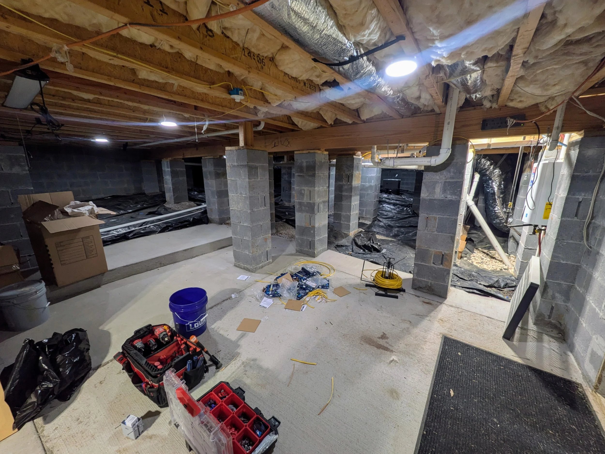 Oranssi technician working on a roof project