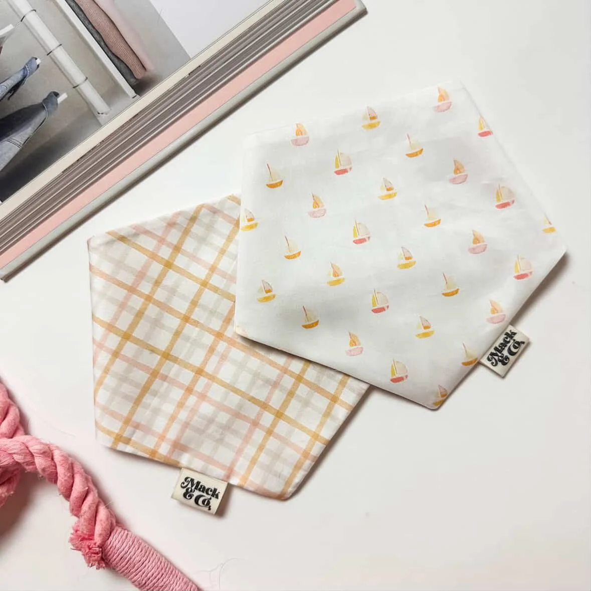 Handmade pet bandanas from Mack & Co featuring watercolour boat and plaid patterns by Rachel de Bruyn