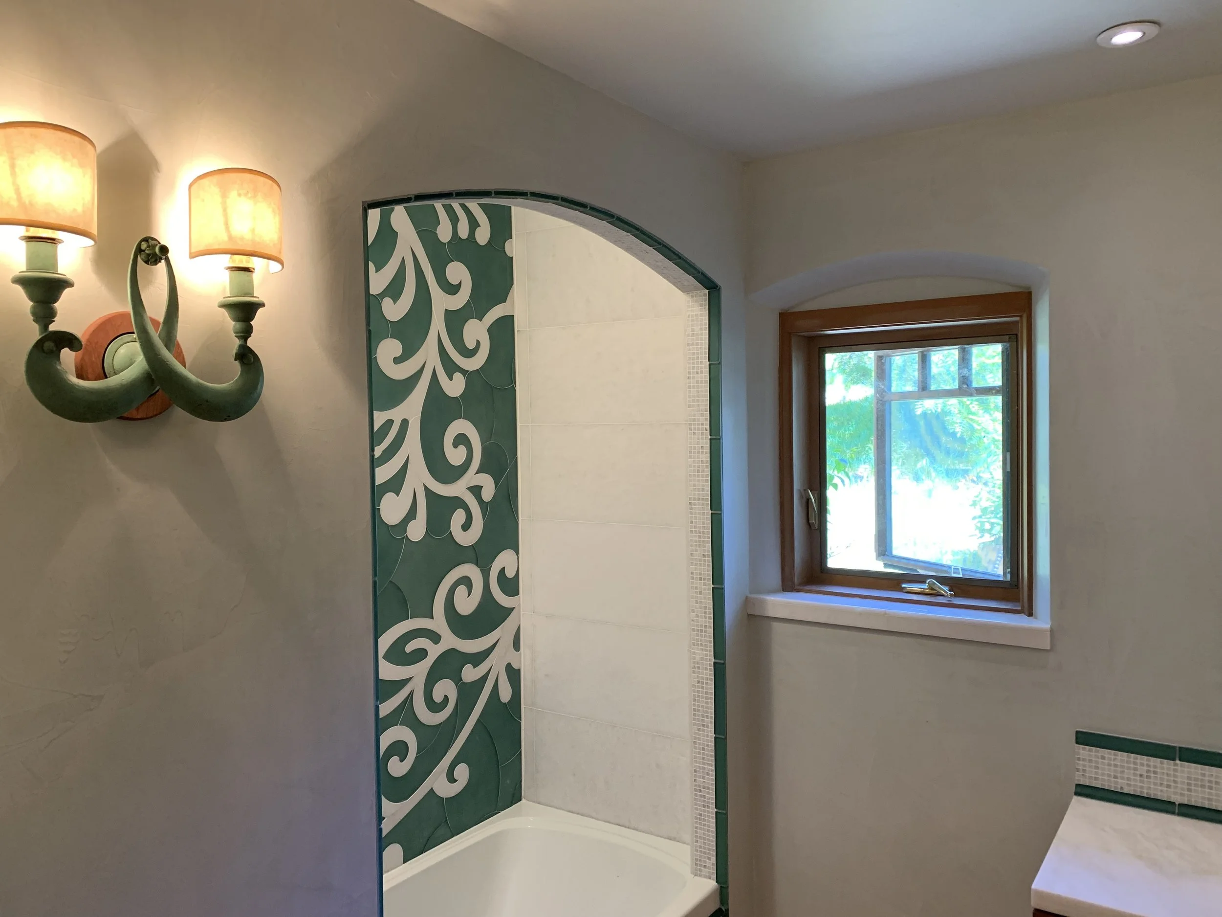 Bathroom renovation with custom tile and custom cabinetry 