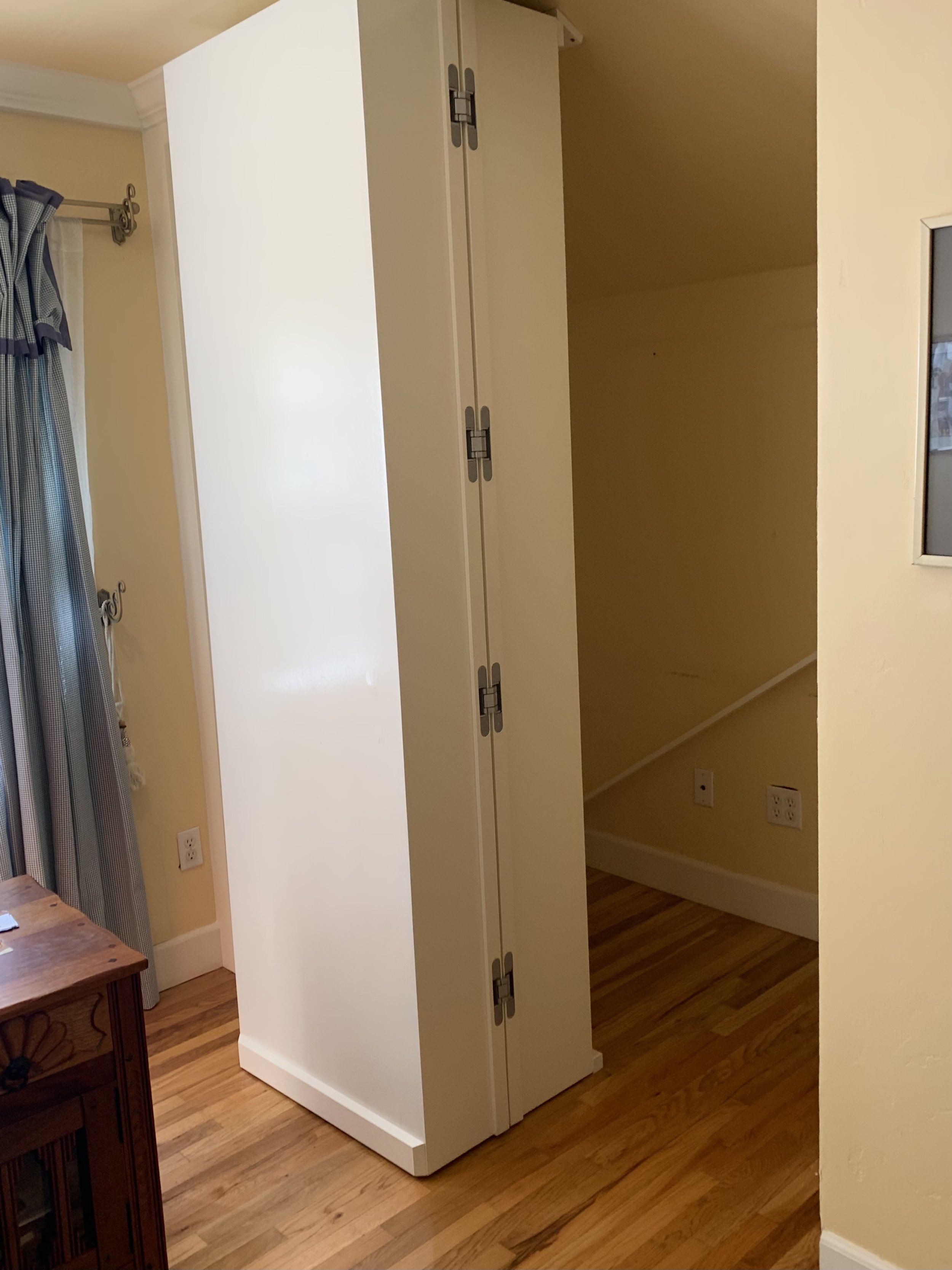 Custom design, build and instal of shelving with hidden door