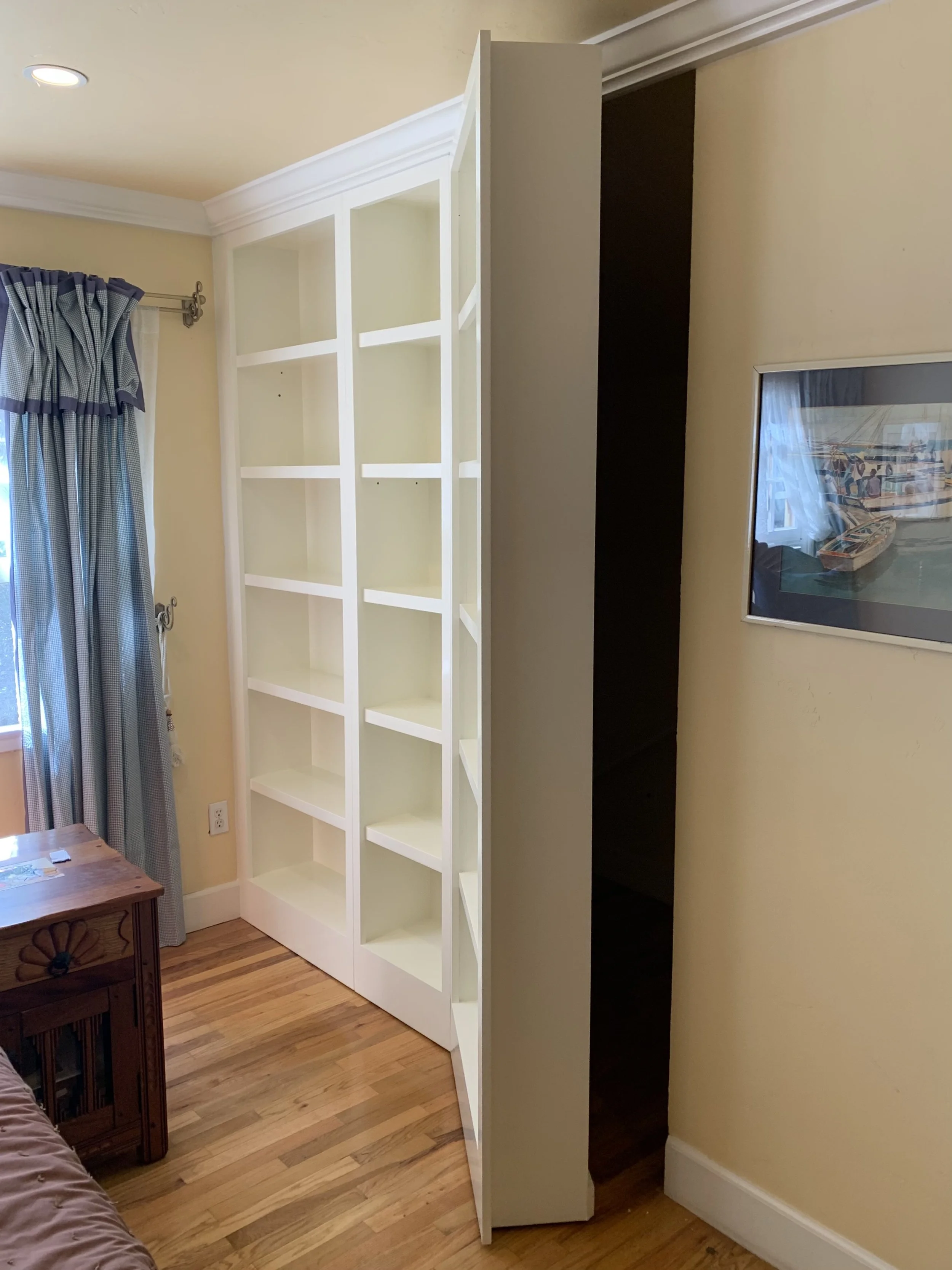 Custom design, build and instal of shelving with hidden door