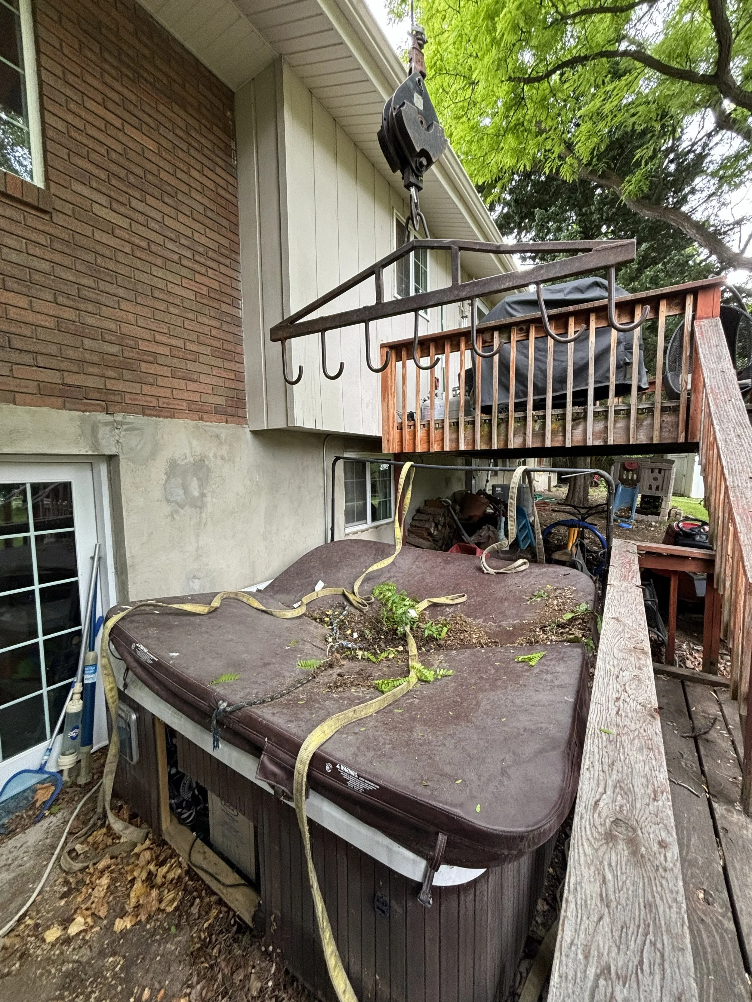 Crane lift of hot tub in Logan Cache County Utah