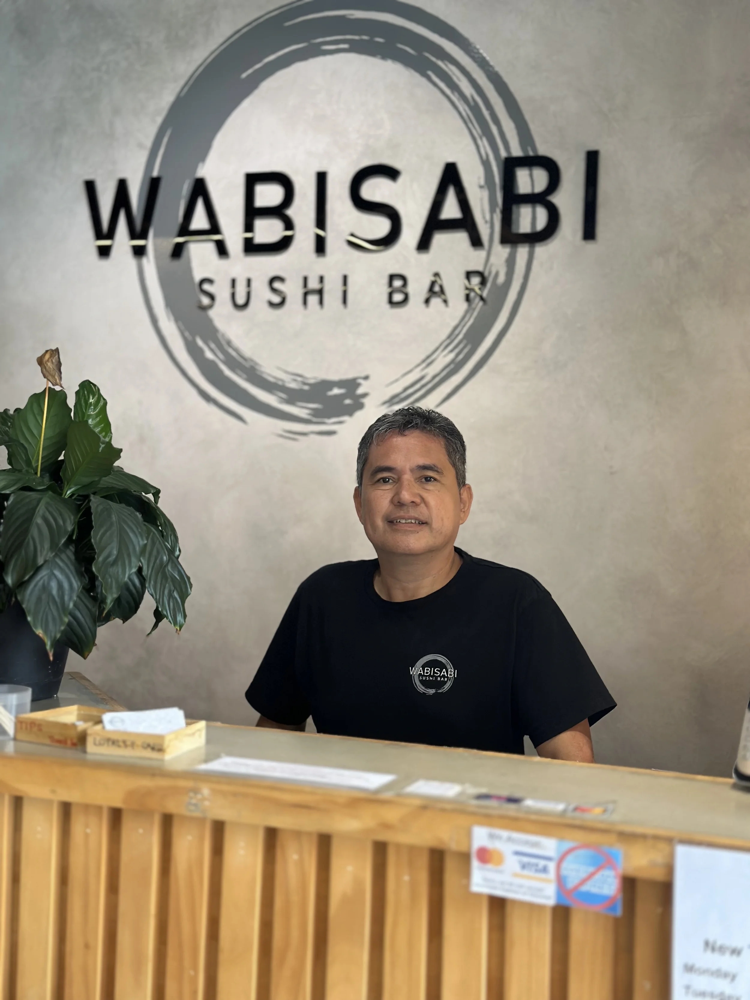 Eddie with the Wabisabi logo behind