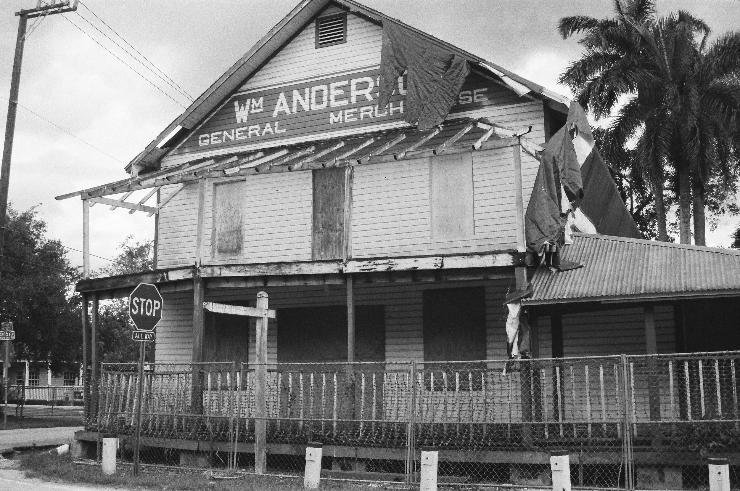 Memphis Billie's 13 x 19 black and white print that shows Southern Decay. The photo is a street photograph from South Florida and features an abanonded building.