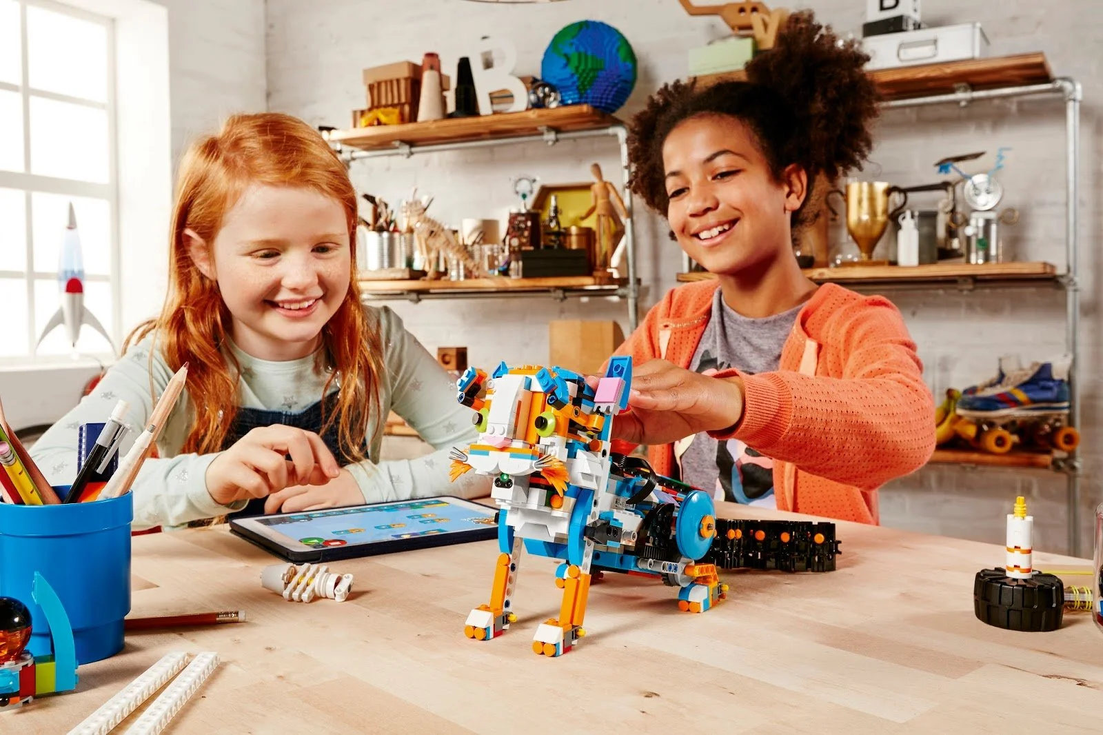 kids building a bricks robot with a motor