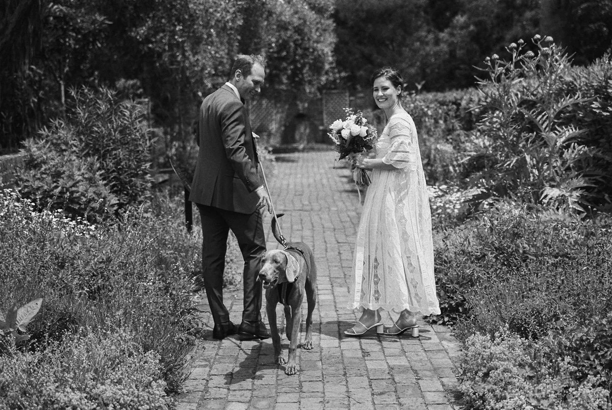 Black and white film wedding couple with dog