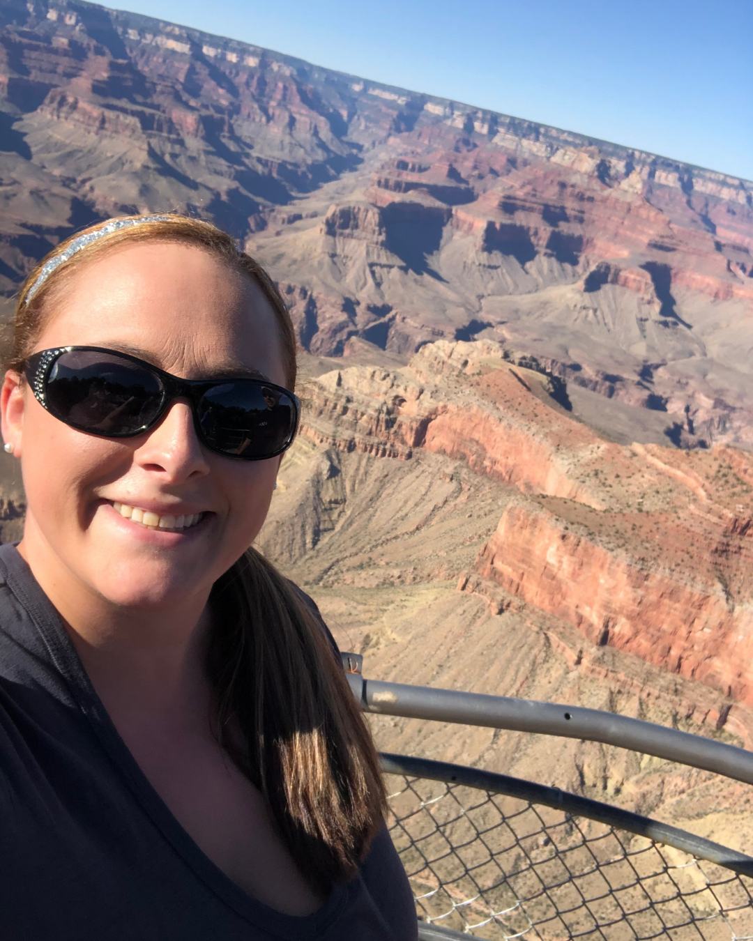 Kendra Harris overlooking the Grand Canyon during a family travel adventure in Arizona.
