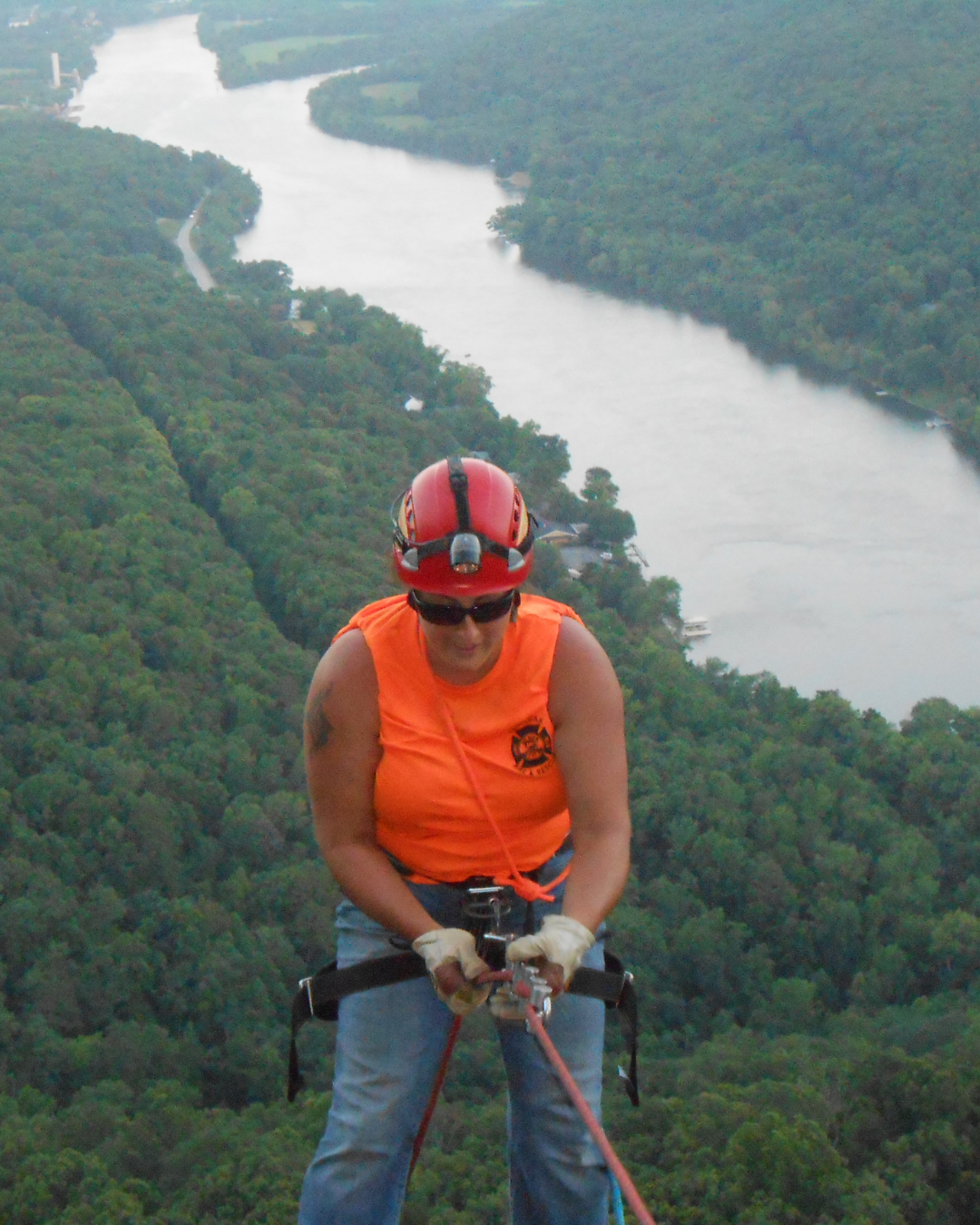 Kendra Harris working as a firefighter and rope rescue technician during high-angle rope rescue training on Signal Mountain overlooking Chattanooga, Tennessee.