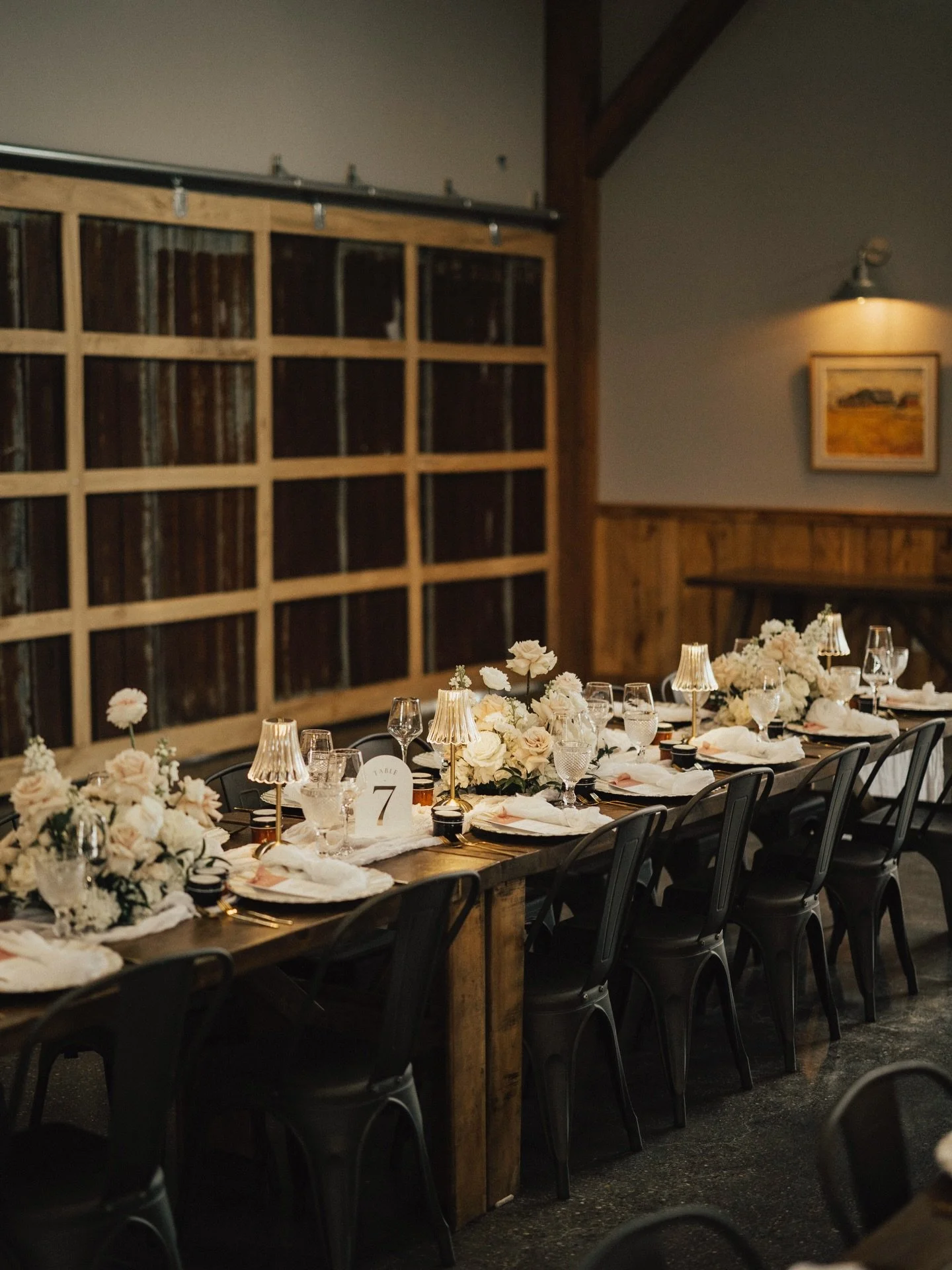 Reception florals set the tone for the way a wedding feels once everyone settles in.

For this design, we leaned into natural texture, soft movement, and pieces that felt rooted in the space rather than overly styled. The goal is always a room that f