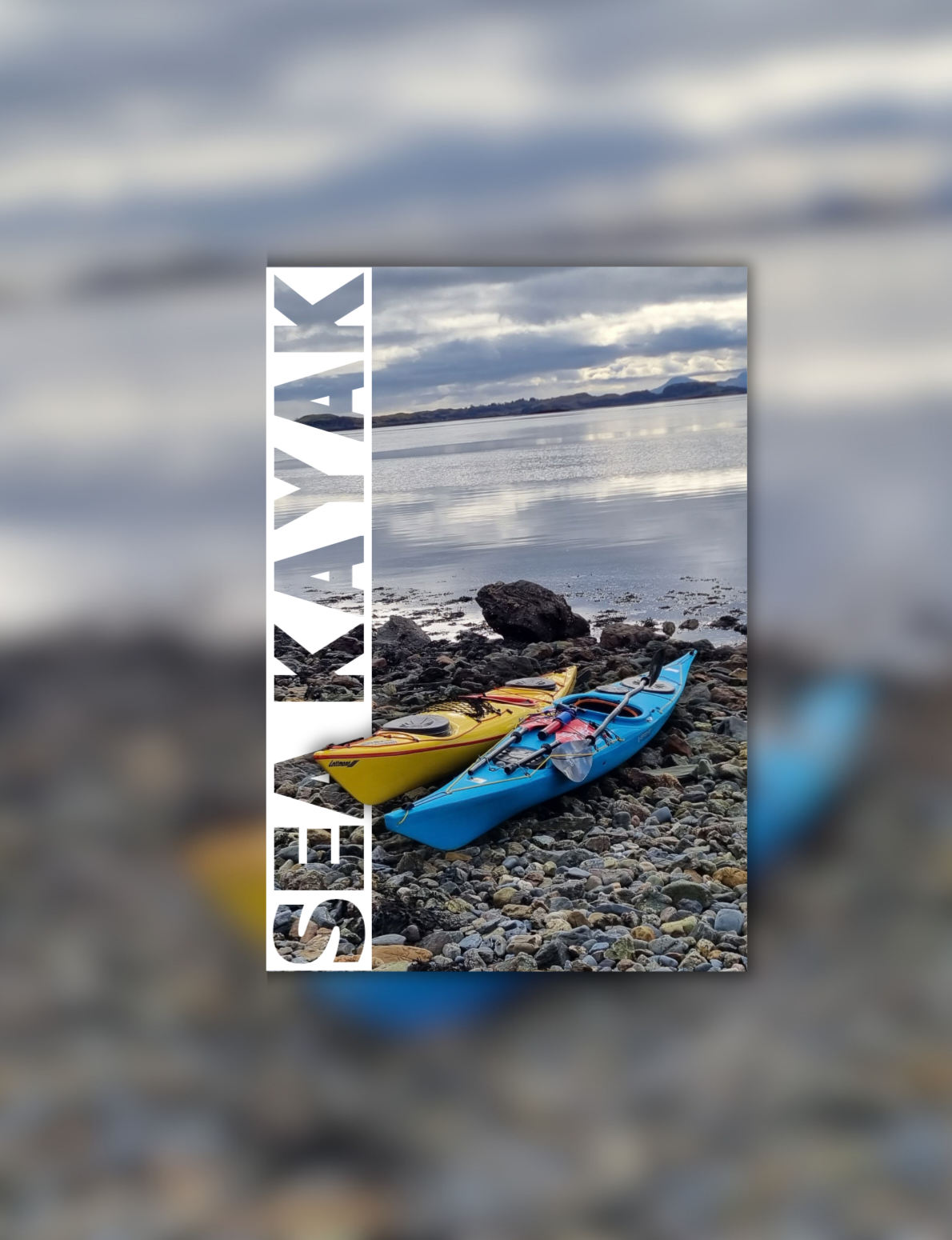Close-up of a paddle with the text 'Mountains and Beyond' and a red mountain logo, on a paddleboard in water. In the blurry background, a person is sitting on a paddleboard in a scenic outdoor setting with mountains and water.