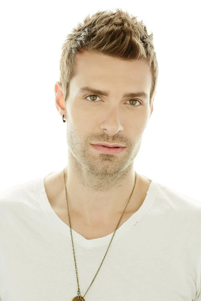Actor-style headshot with a natural, relaxed expression