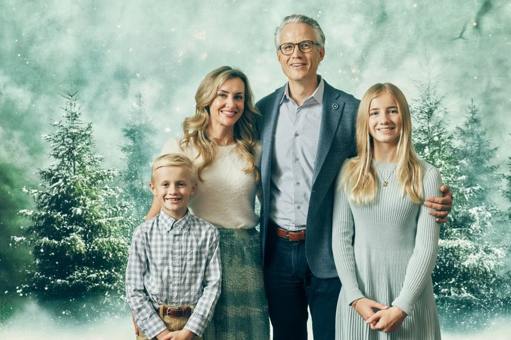 Relaxed studio family portrait with natural expressions